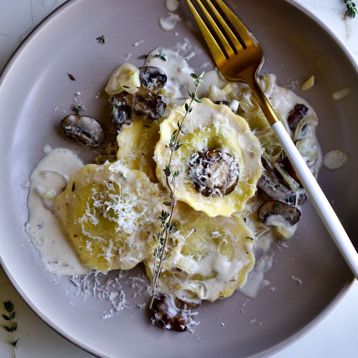 mushroom ravioli with cream sauce cover photo