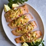large serving platter with fillets of stuffed fish. Garnish lemon wedges and parsley.