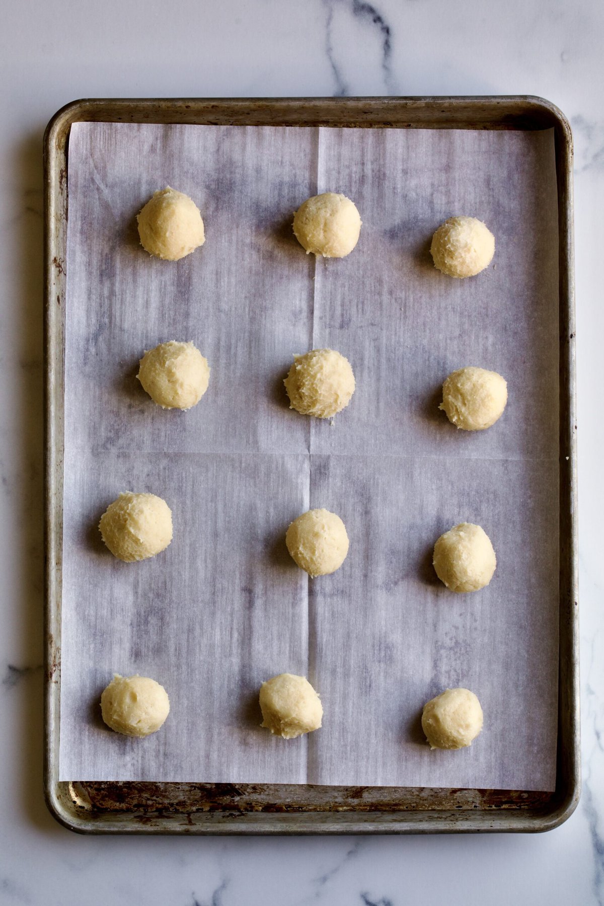 process of making cookies into balls. 