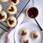 heart jam cookies on a plate and on wire cooling rack.