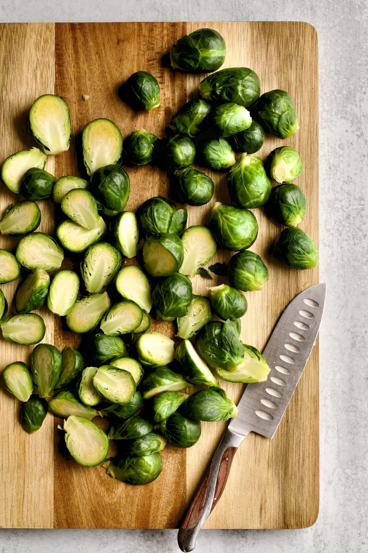 how to make Longhorn Steakhouse Crispy Brussels Sprouts Recipe: cutting Brussels sprouts in half.