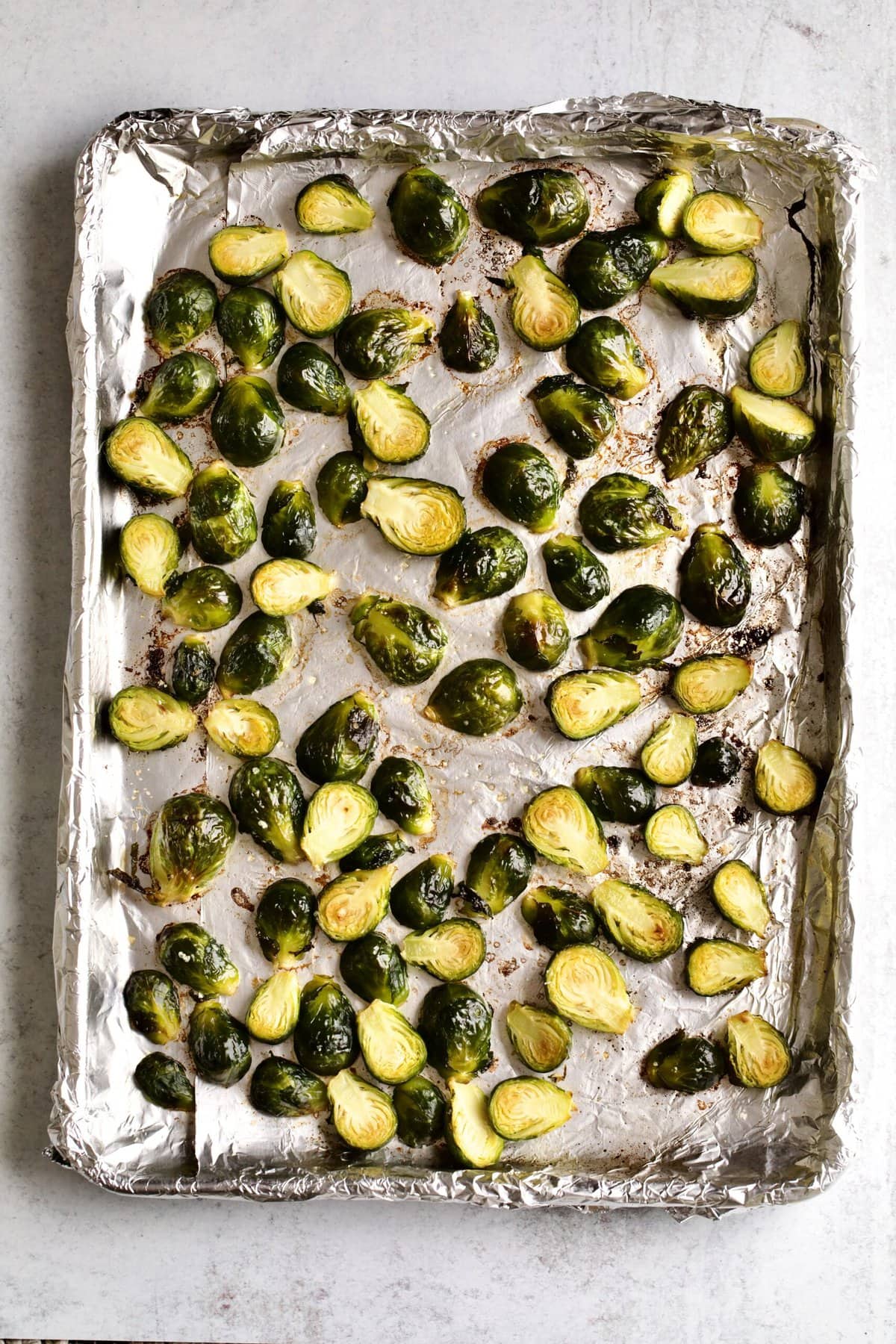 how to make Longhorn Steakhouse Crispy Brussels Sprouts Recipe: roasting the Brussels Sprouts on a pan.