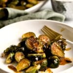 Copycat Longhorn Steakhouse crispy brussels sprouts on a plate with a fork.