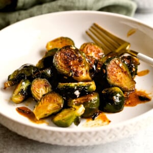 cover photo.Longhorn Steakhouse Crispy Brussels Sprouts Recipe on plate.