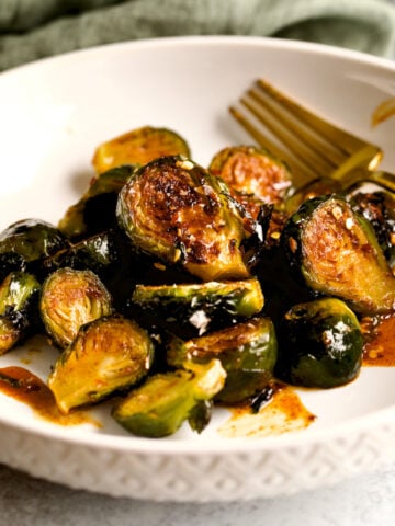 cover photo.Longhorn Steakhouse Crispy Brussels Sprouts Recipe on plate.