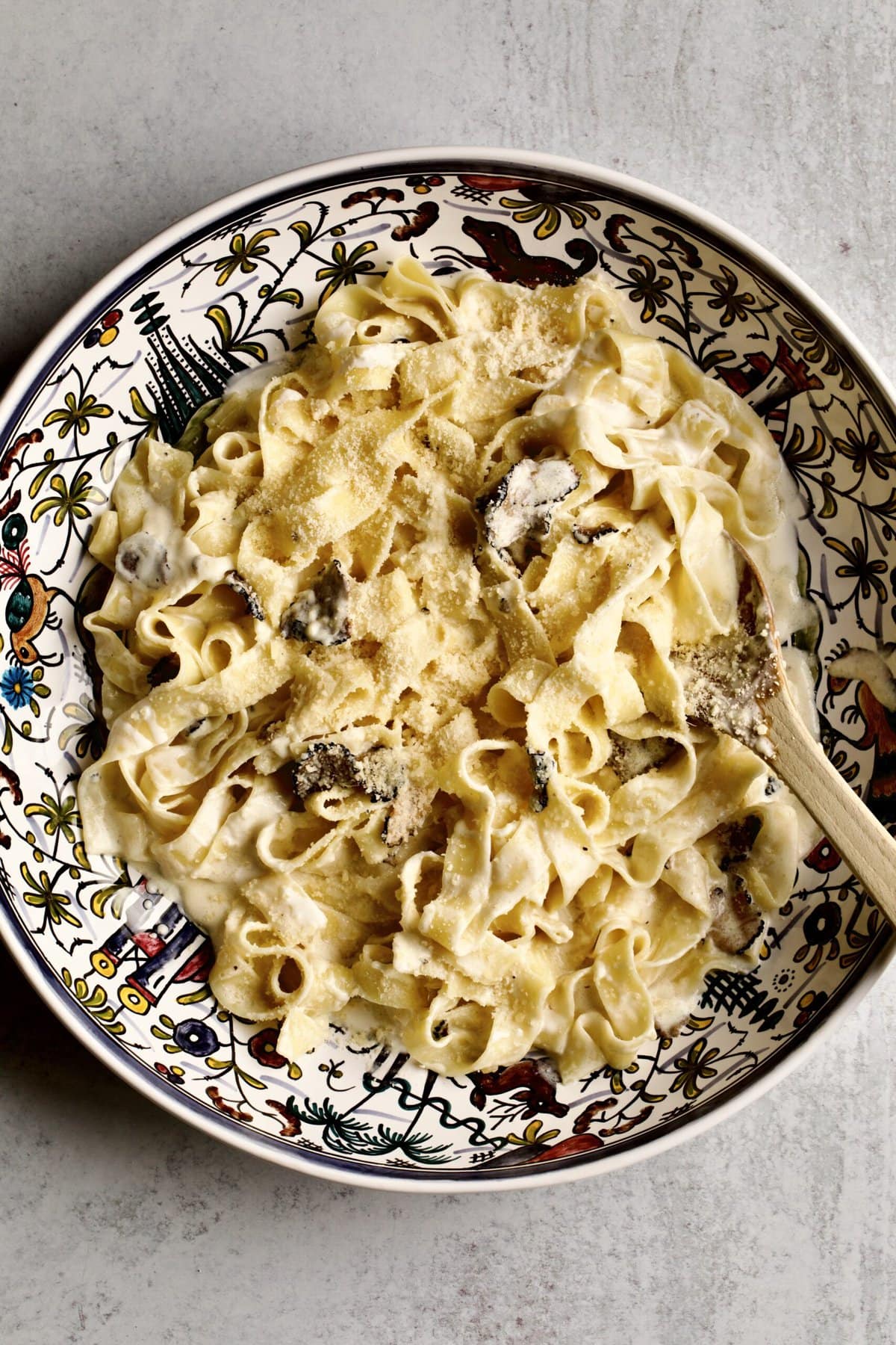 final black truffle sauce pasta in a serving platter. 