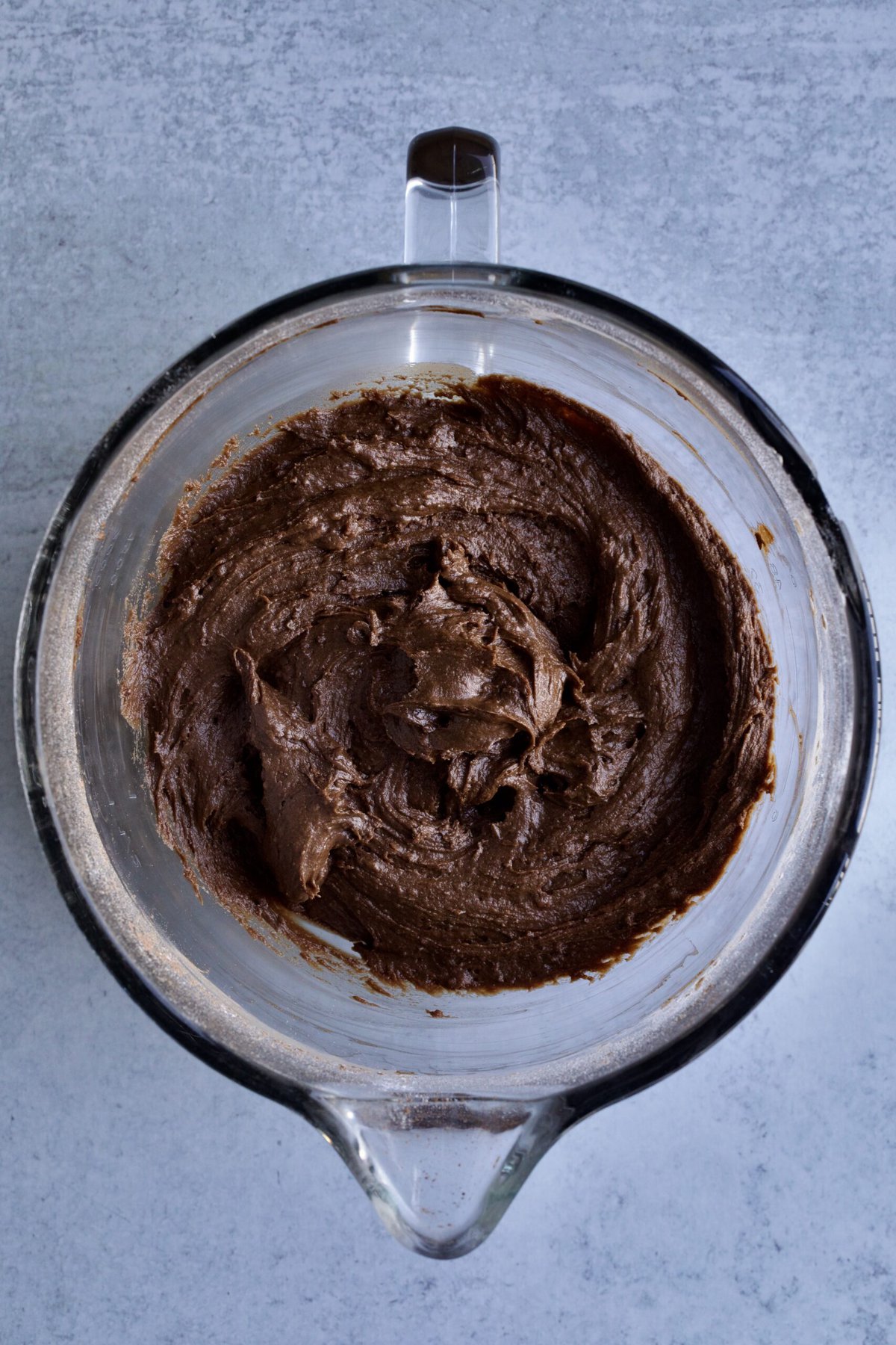process for making Italian chocolate spice cookies: mixing wet and dry ingredients to a smooth and sticky dough.