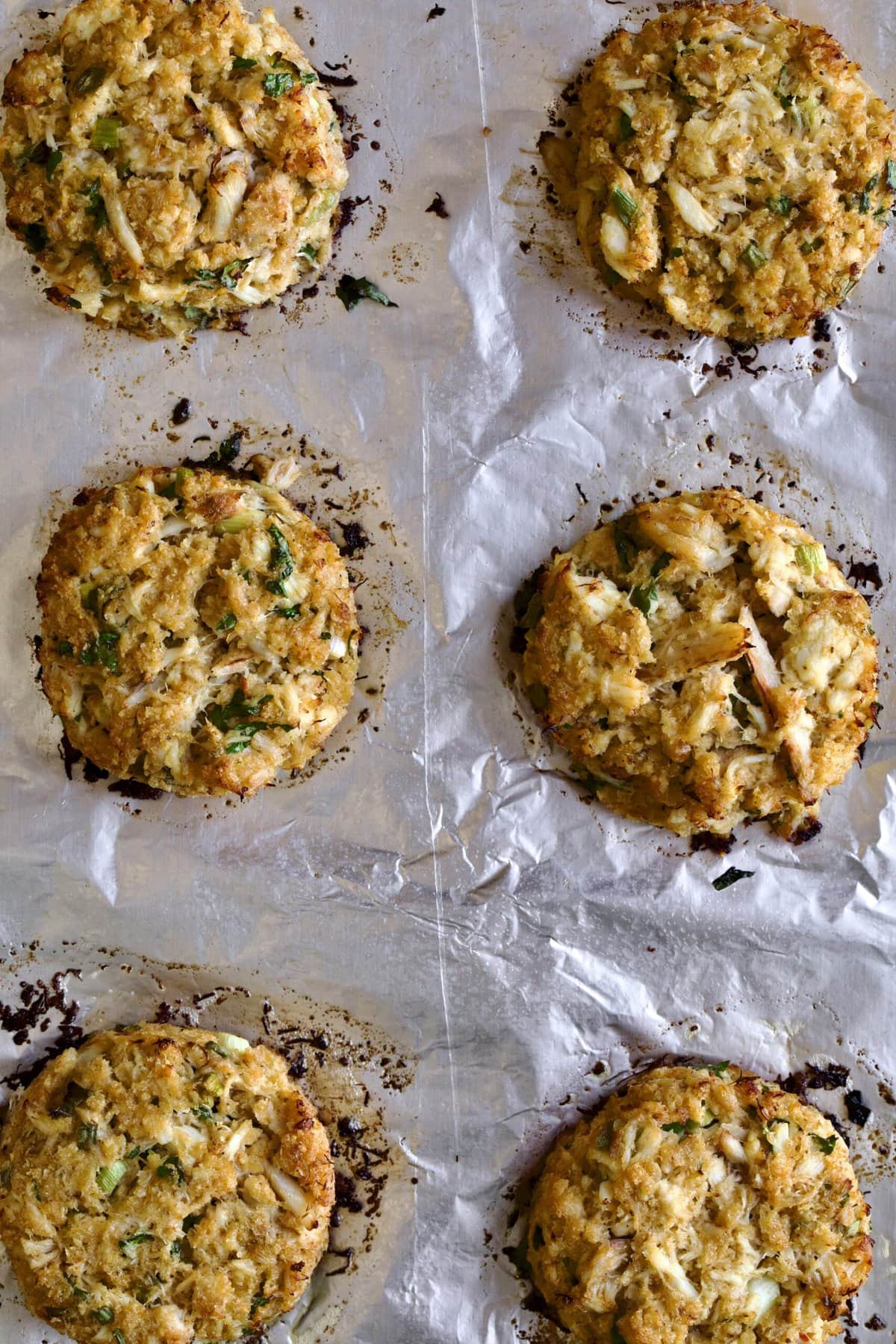 bakes crab cakes on baking sheet.