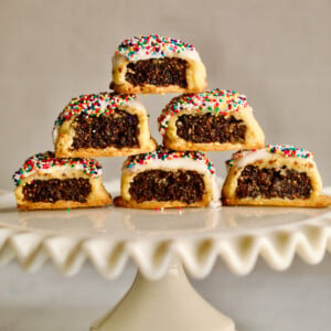 Italian fig cookies stacked on a raised platter.