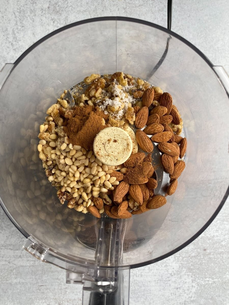 Grinding nut mixture and spices in mixer.