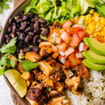 Pollo Asado Recipe (Chipotle Copycat) made into a rice bowl with sides