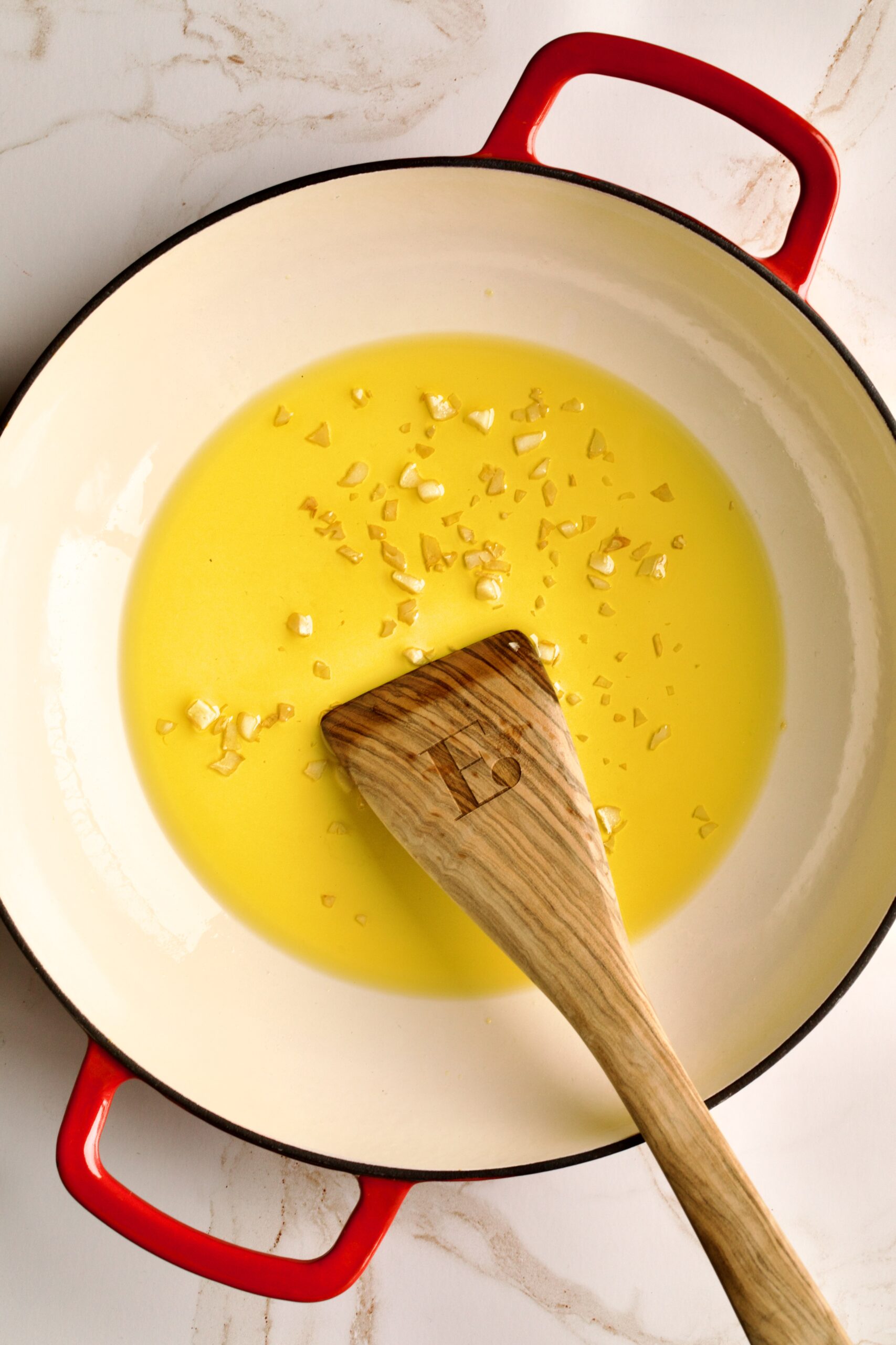 process for making- Angel Hair Pasta Recipe with Garlic and Herbs (Easy)- sautéing garlic in olive oil