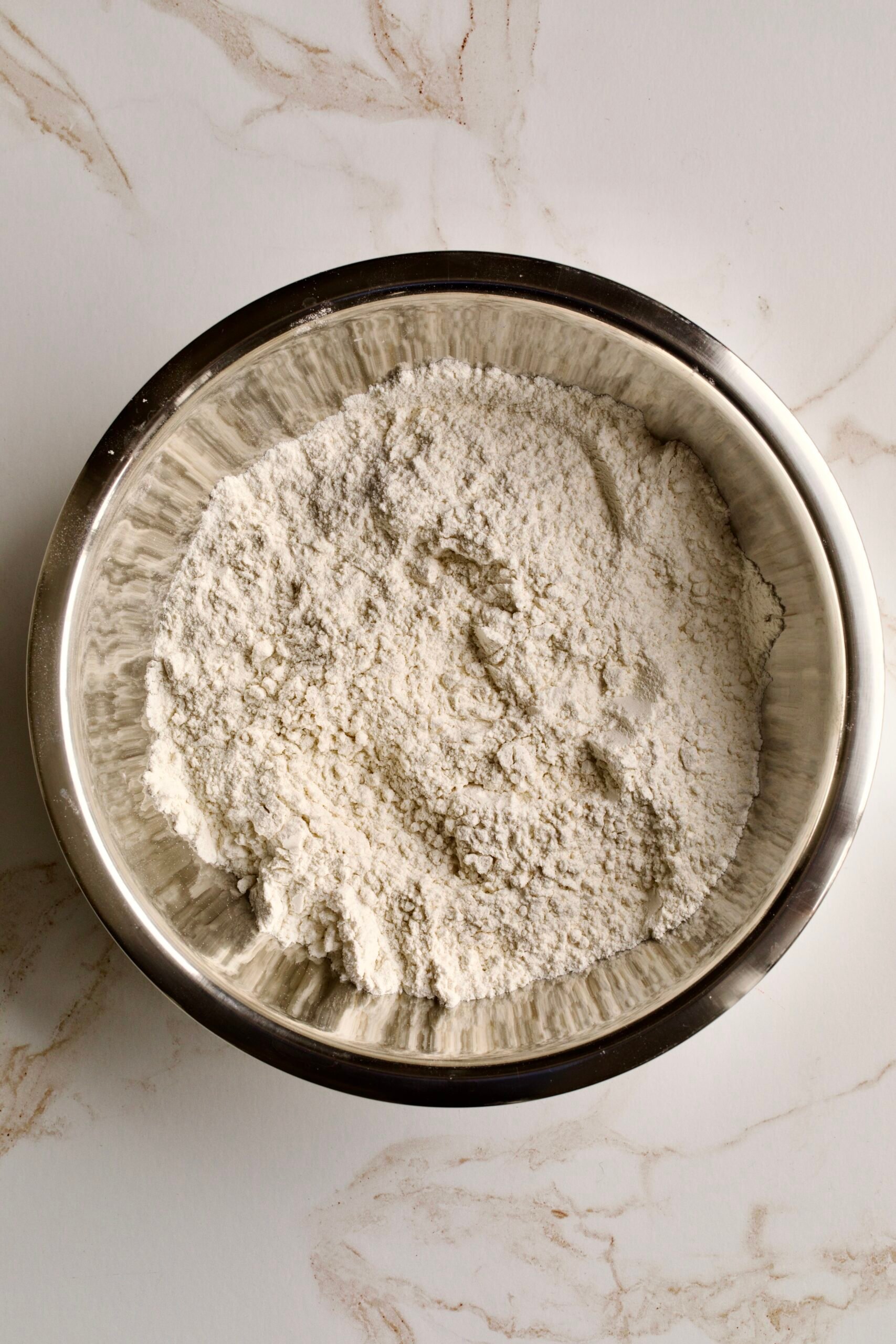 process of making chiacchiere: rolling out the dough phase 1