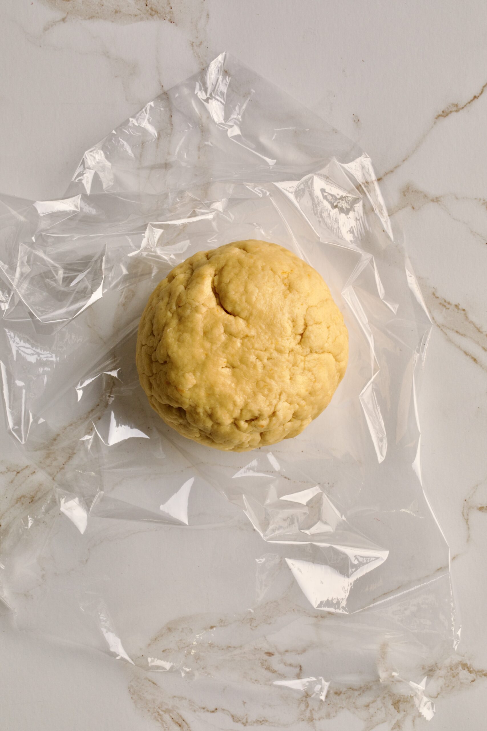 process of making chiacchiere: making dough ball. Letting it rest in the fridge.