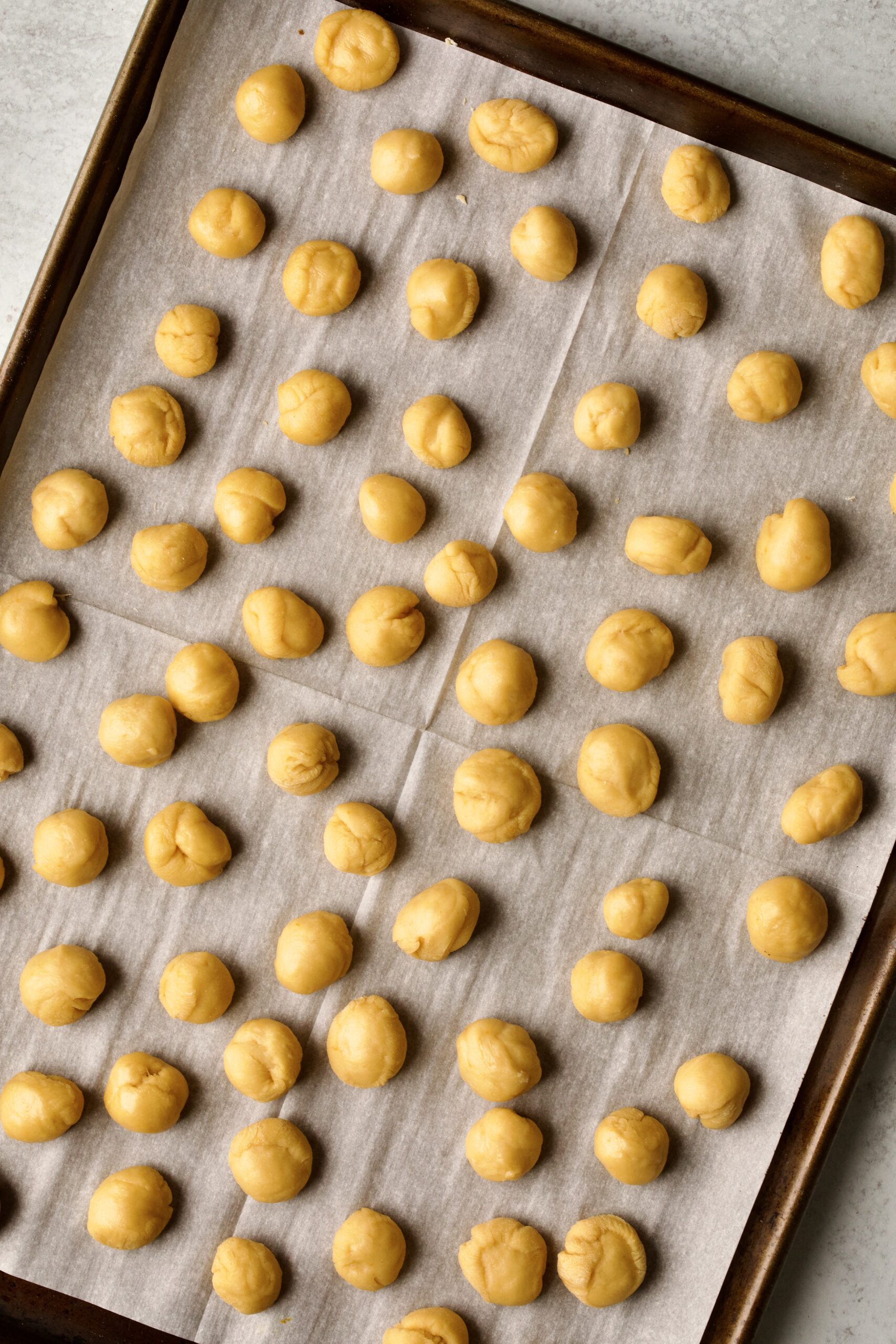 process of making authentic struffoli recipe: dough balls ready to fry.