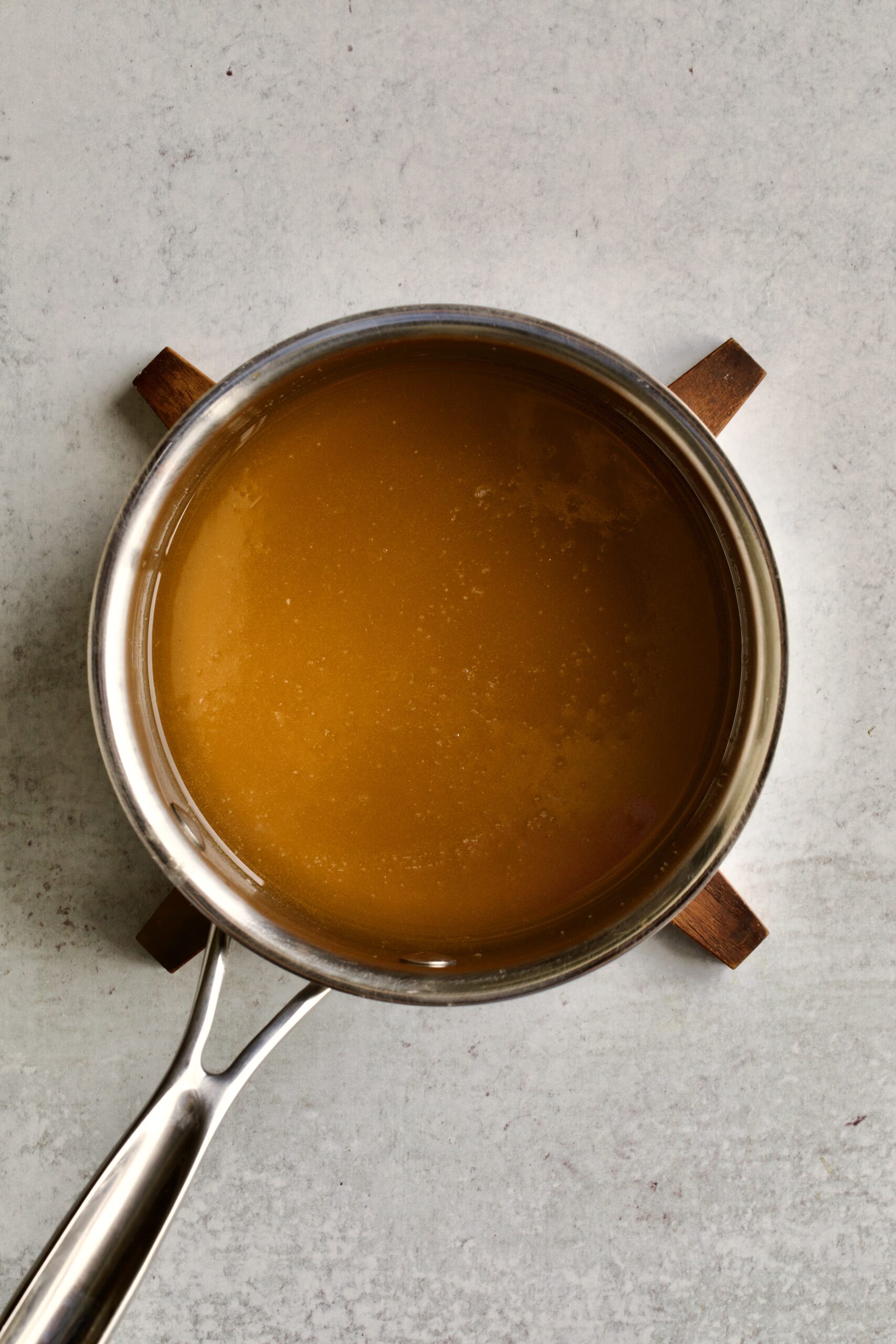 process of making authentic struffoli recipe: making the honey and orange mixture.