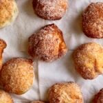 close up of zeppole on paper napkins.