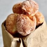 Zeppole Recipe (Easy Italian Donuts)zeppole coming out of brown paper bag.