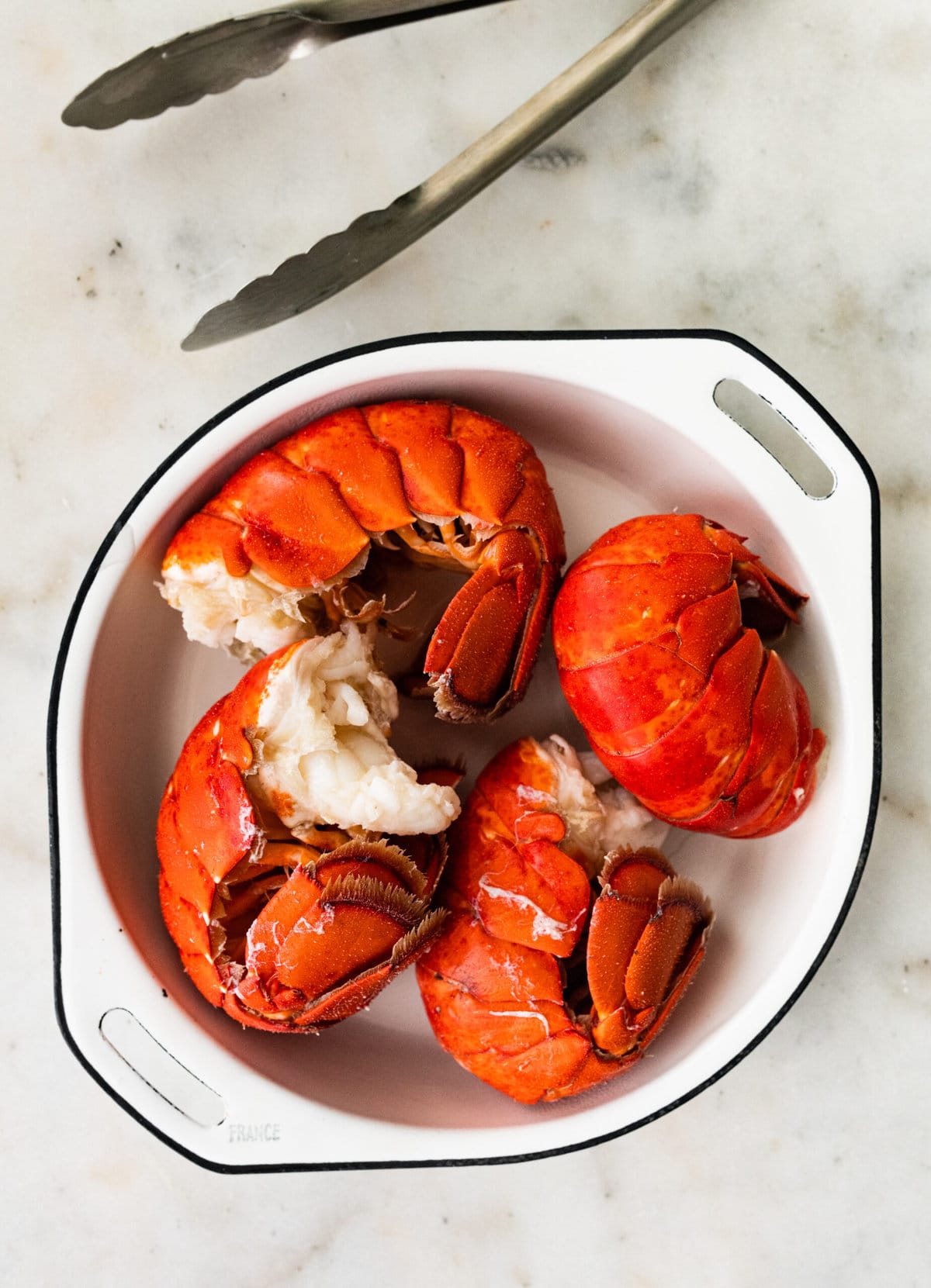 process of making classic lobster bisque: lobster in a dish after boiling.