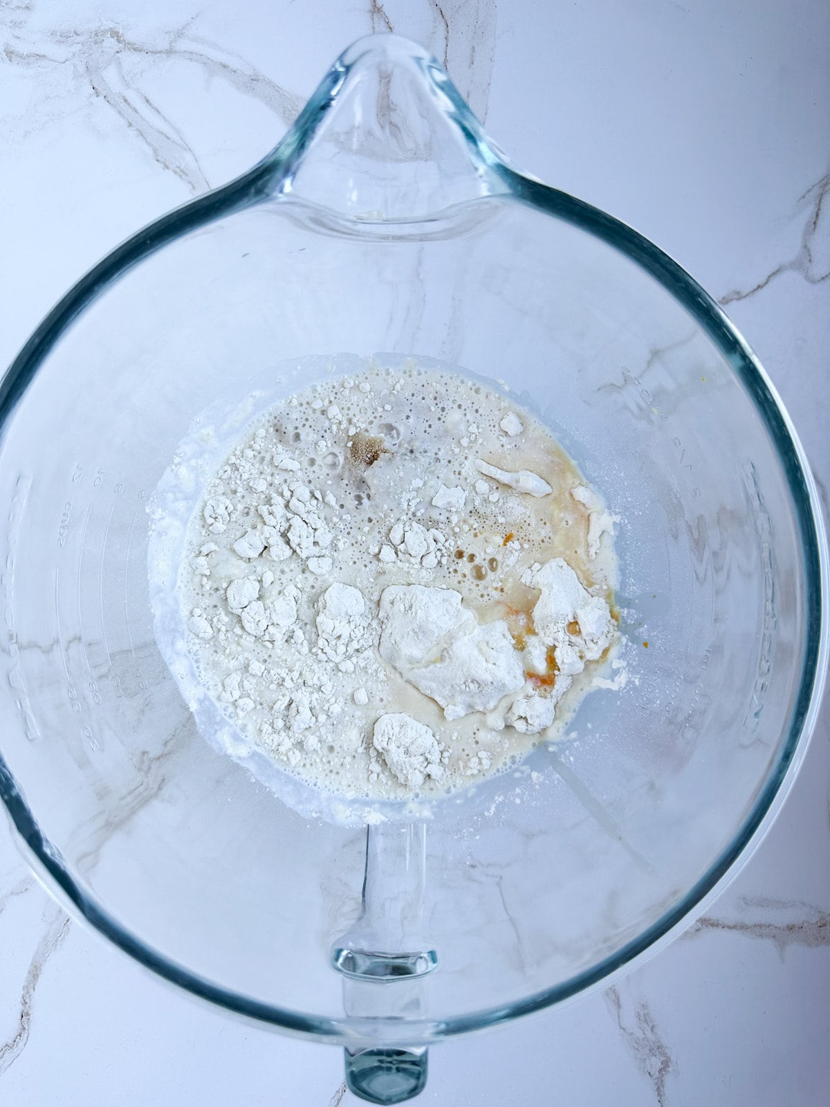 making zeppole dough- adding wet ingredients to dry ingredients