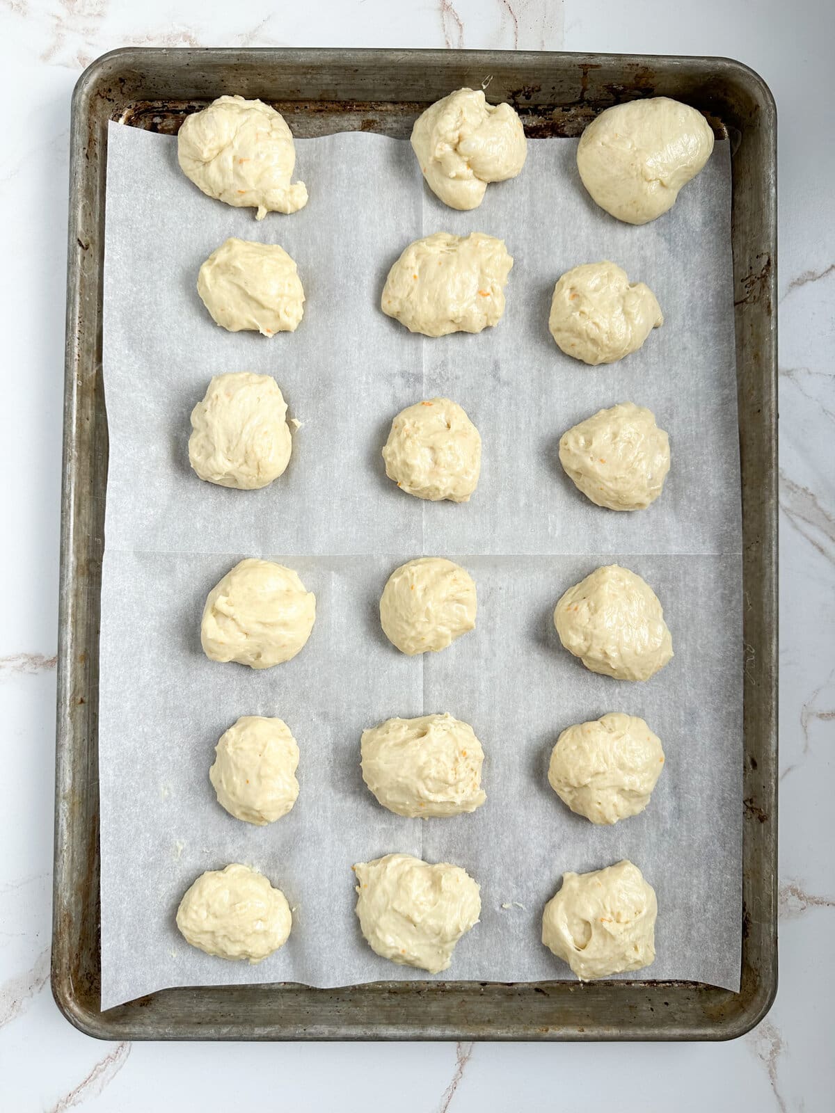 process of making zeppole: rolling into dough balls