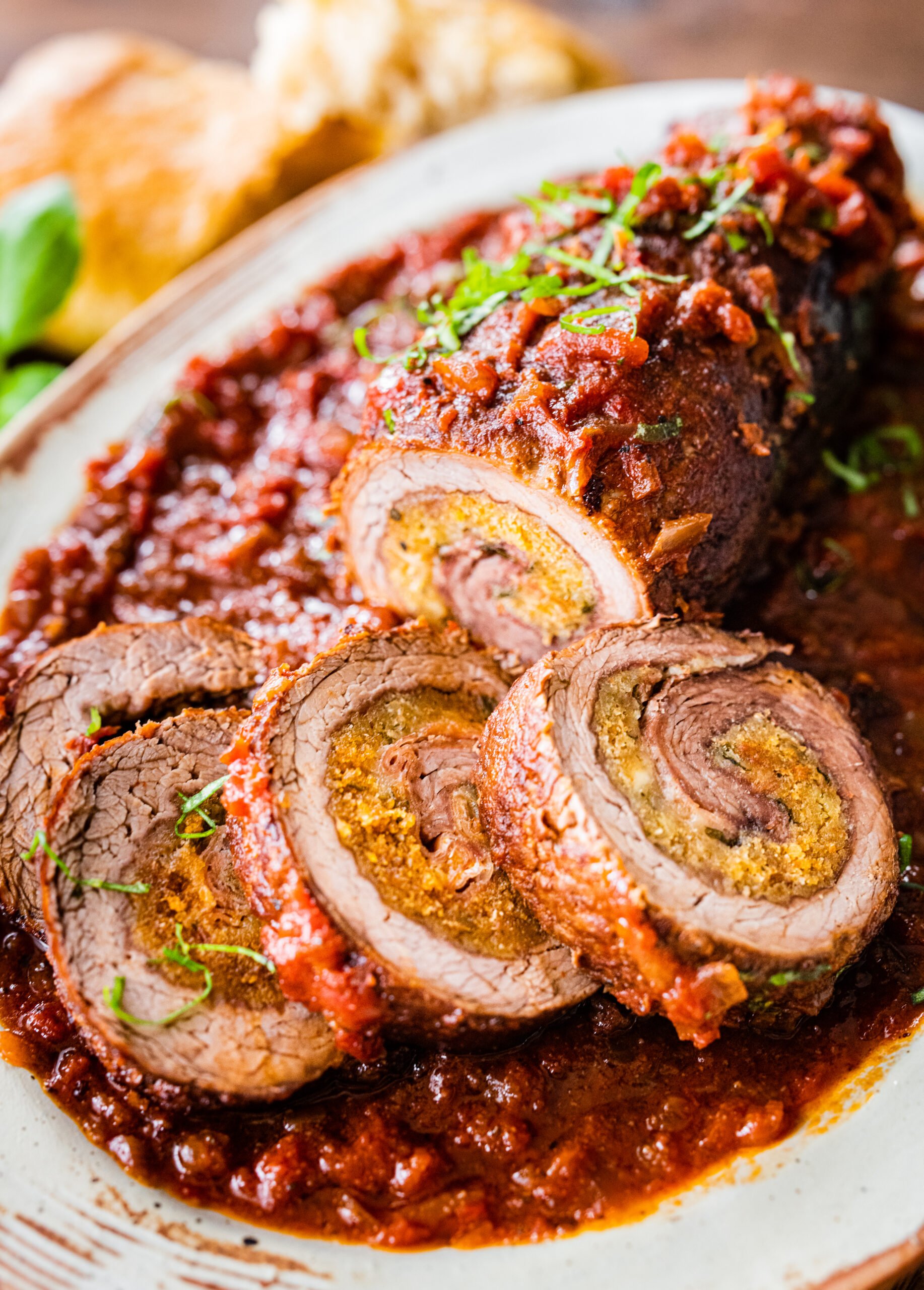 Italian Braciole recipe in slices on a serving plate