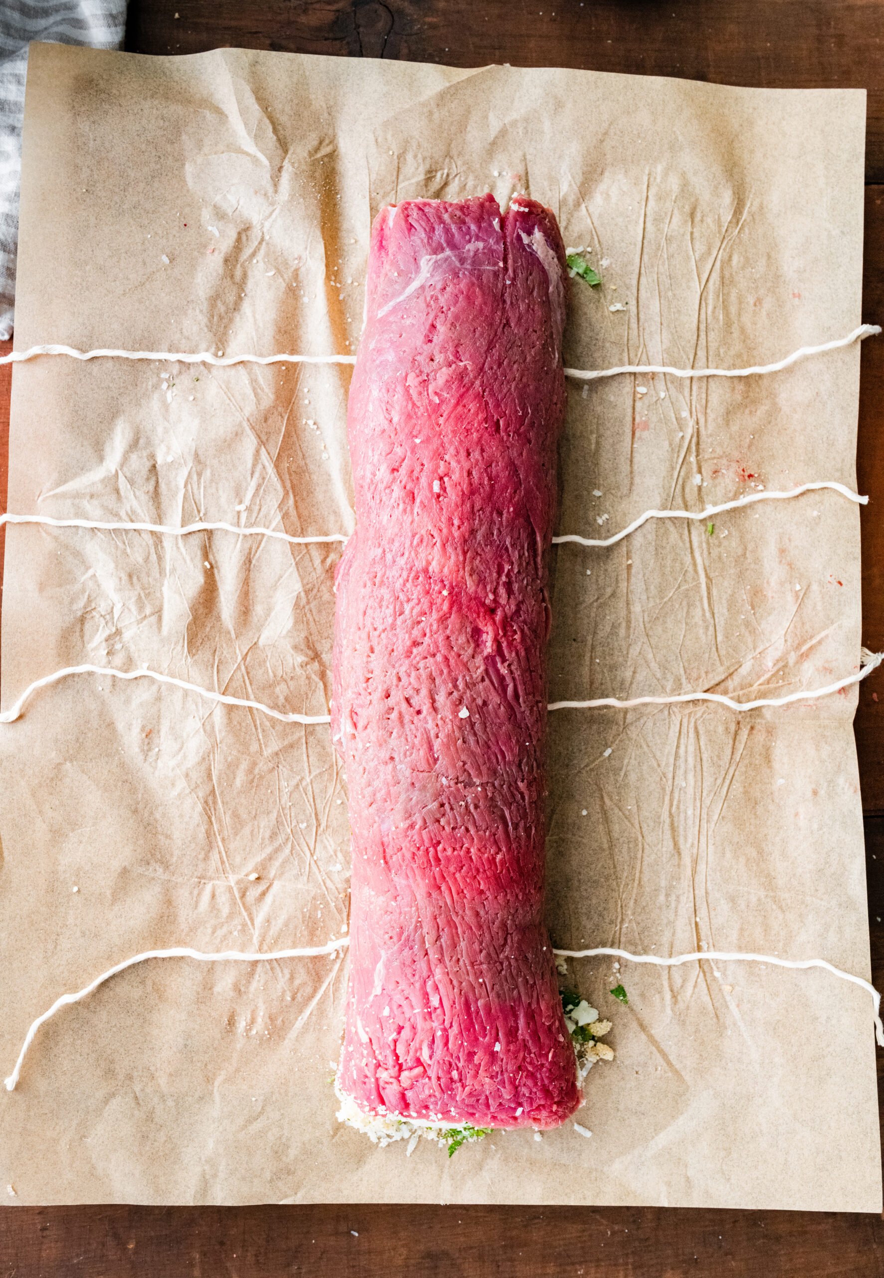 How to make Italian Braciole Process: tying the beef roll with butcher's twine