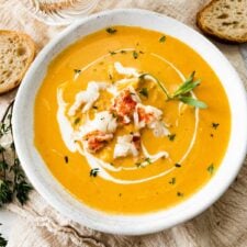 White bowl of lobster bisque.
