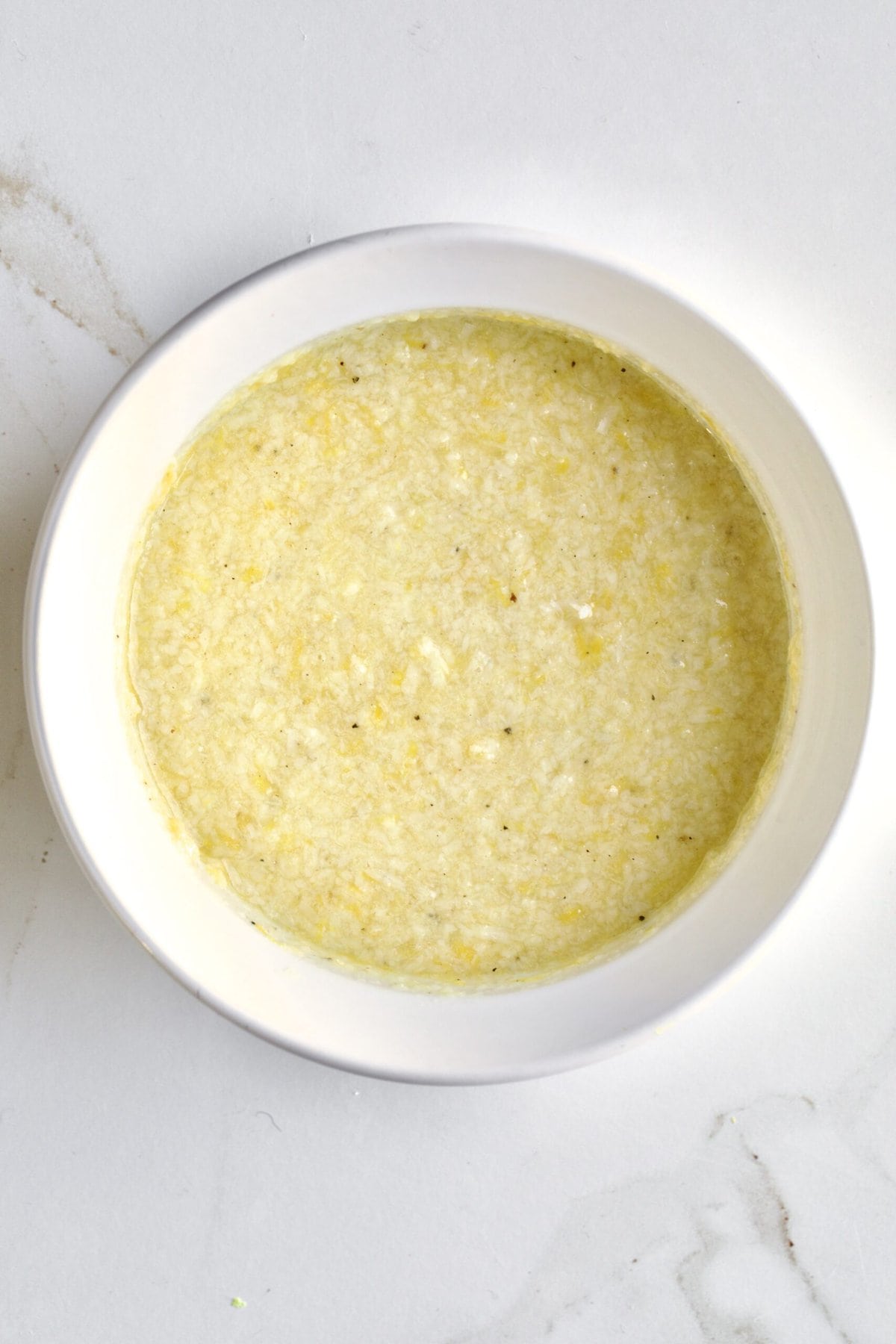 how to make Lemon Butter Pasta Sauce (Pasta al Limone)- making the parmigiano and olive oil mixture in a bowl