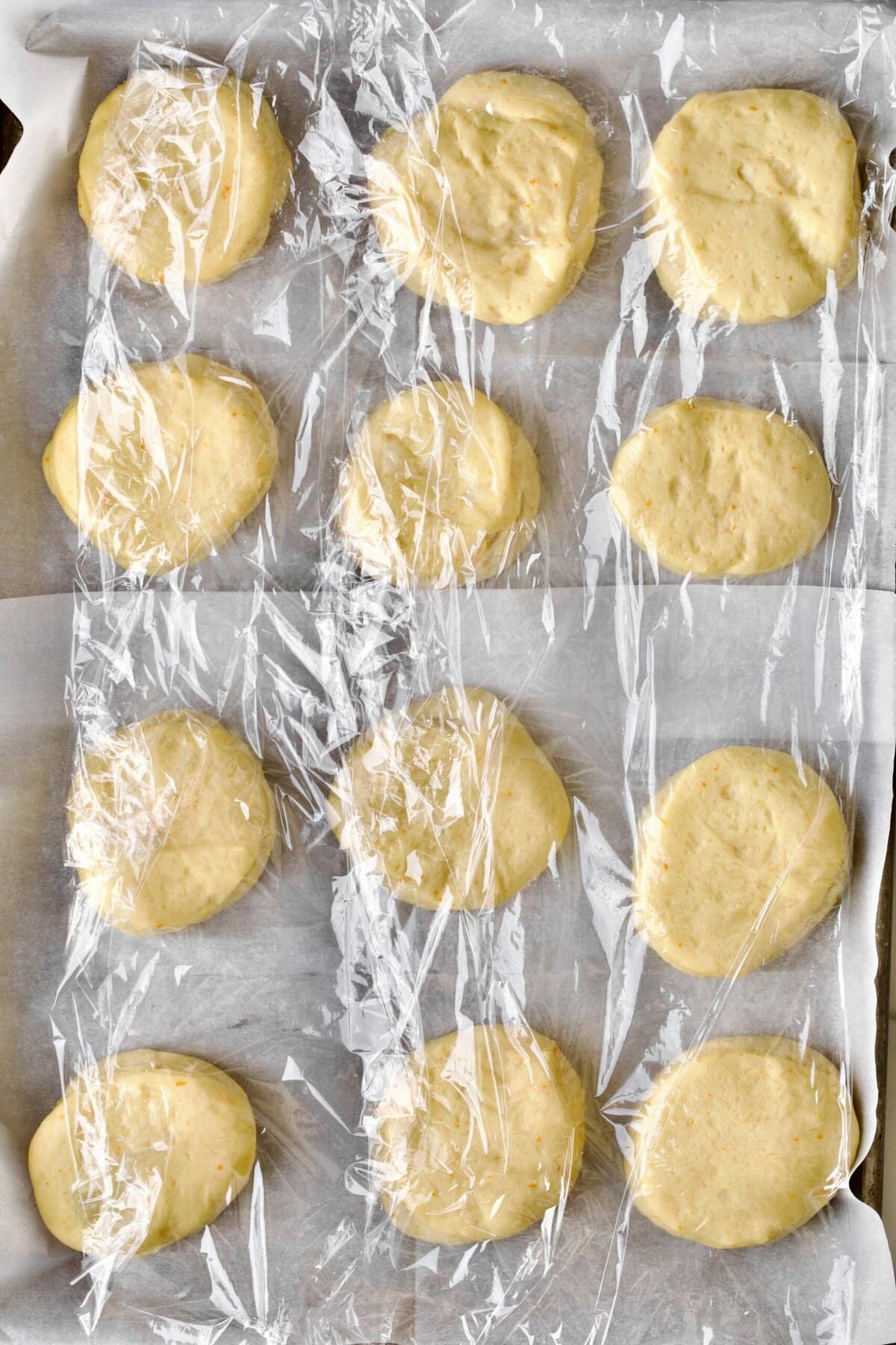 Process of making Bomboloni (how to make bomboloni recipe)- covered donuts ready for second rise.