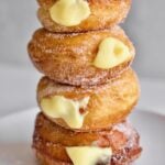 Bomboloni Recipe (Italian Donuts with Cream Filling) stacked on a plate