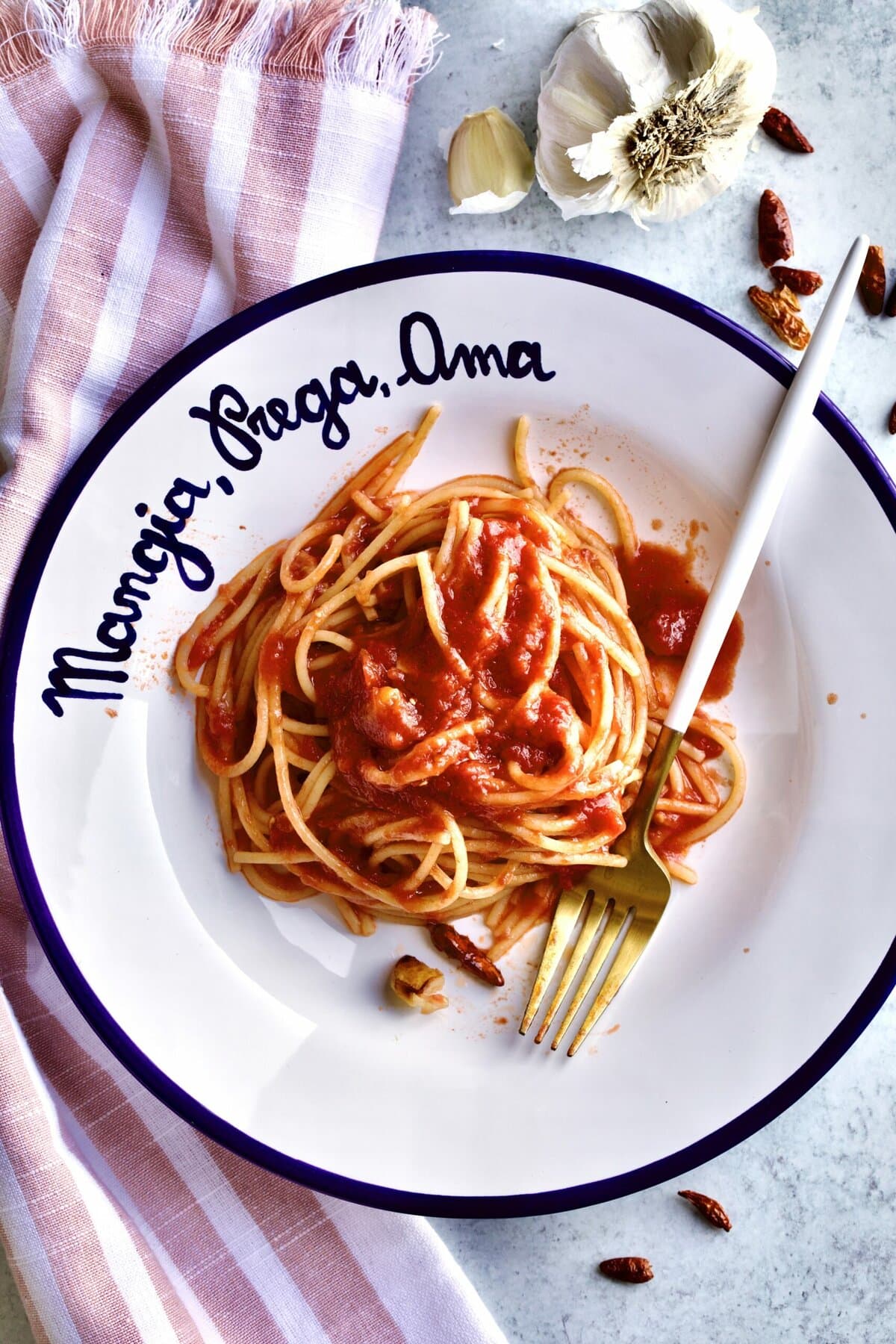 Best Arrabbiata Sauce Recipe (Spicy Spaghetti Sauce) on a plate with a fork in it.