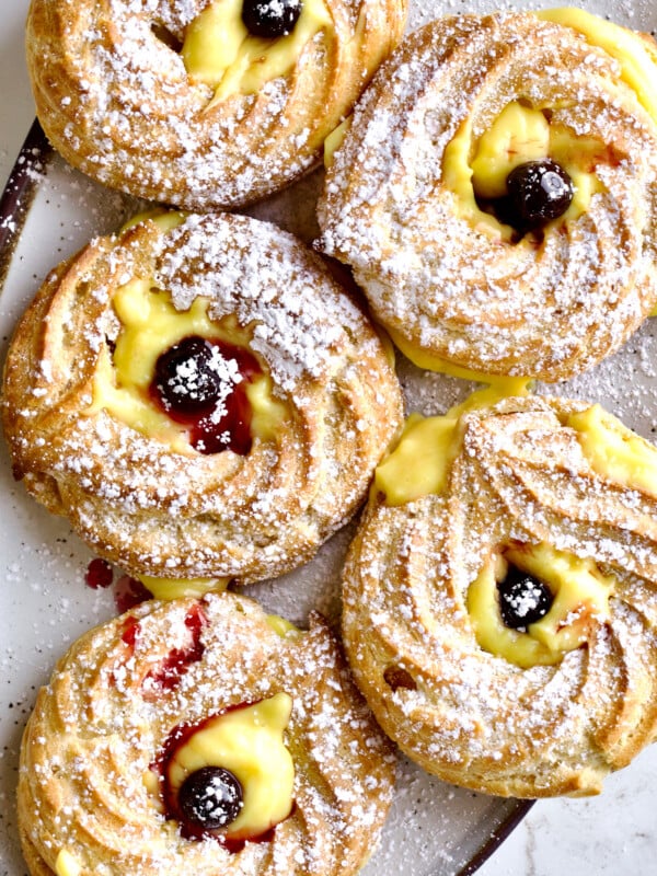 Zeppole di San Giuseppe on an oblong plate.