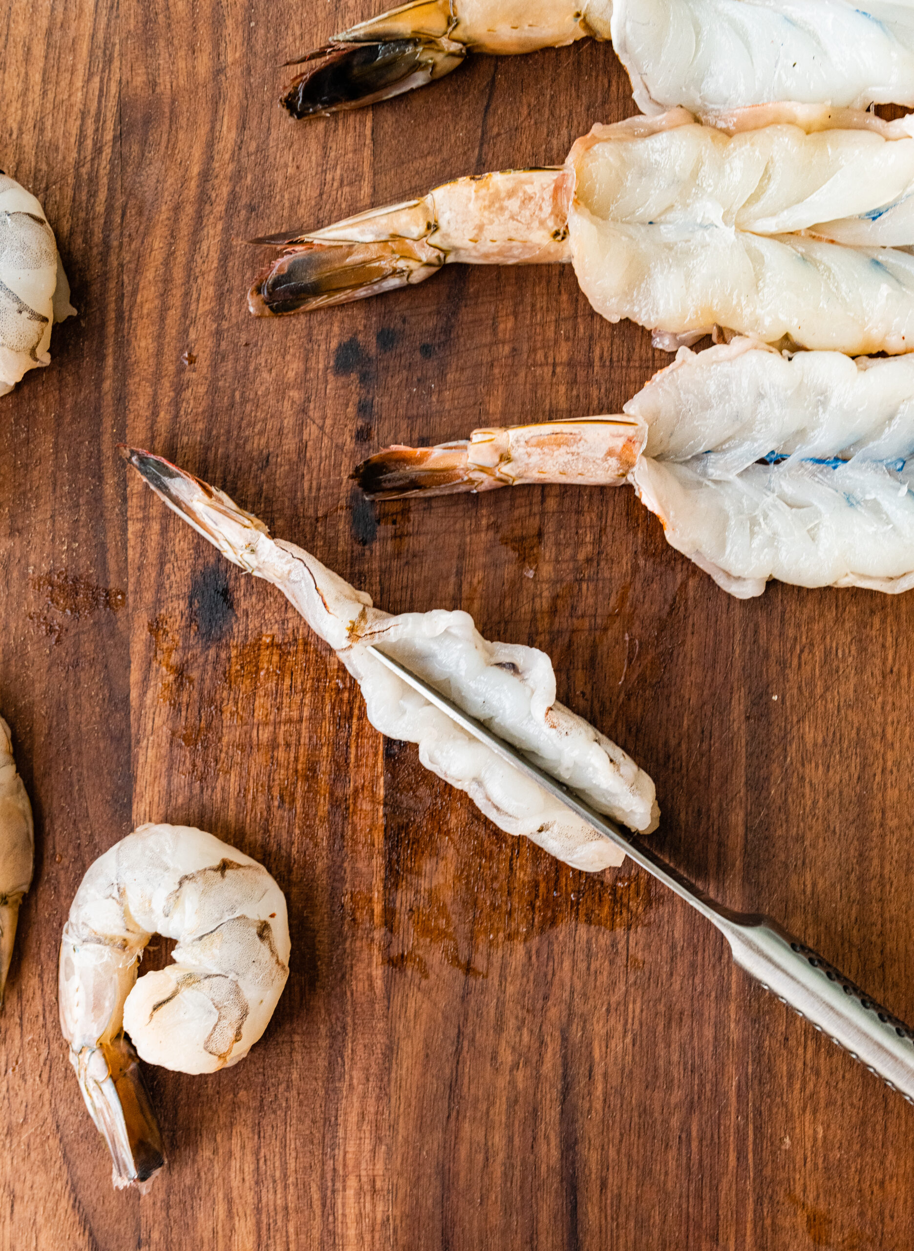 process for how to make Fried Butterfly Shrimp Recipe (Easy and Crunchy)- butterflying the shrimp with a sharp knife.