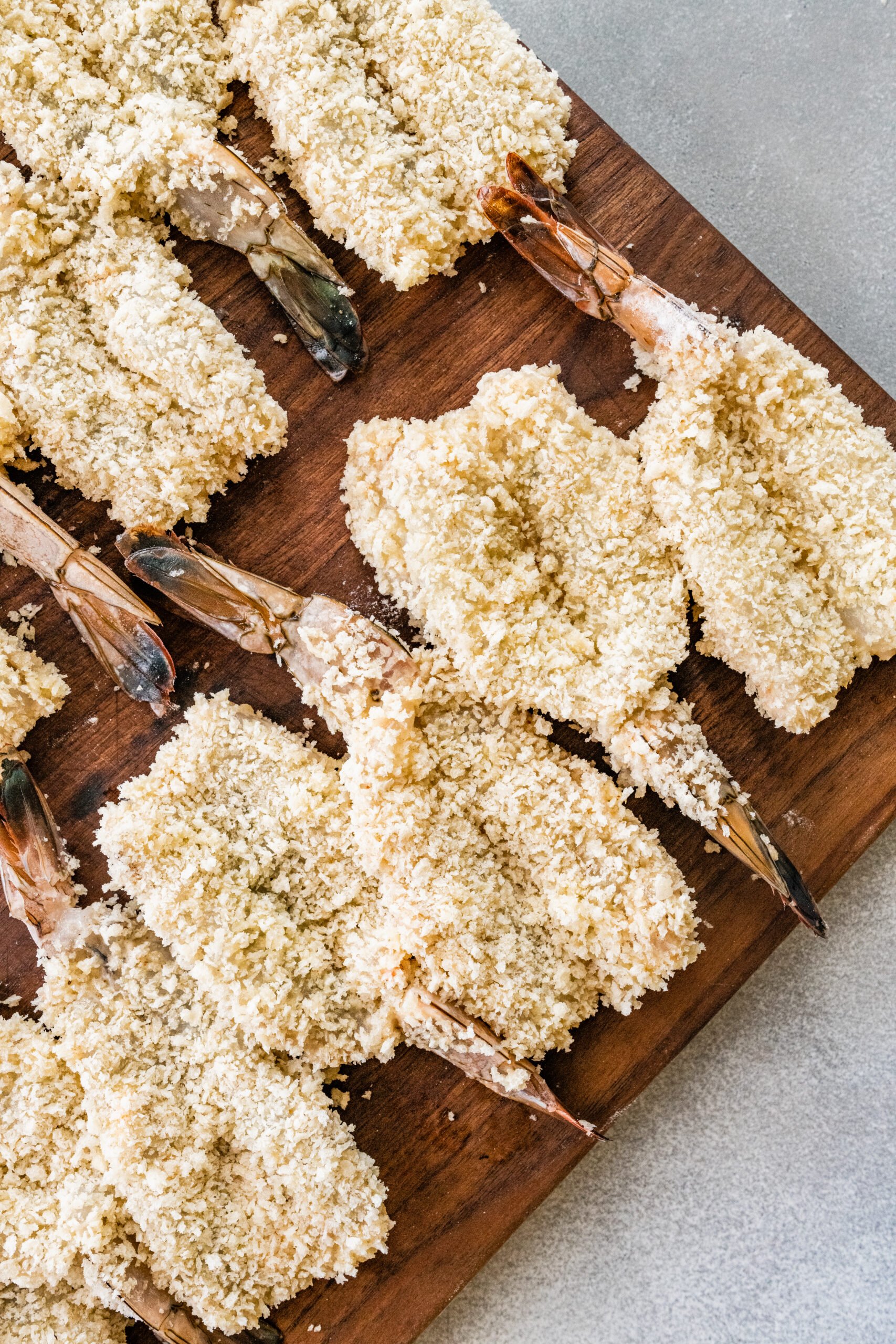 process for how to make Fried Butterfly Shrimp Recipe (Easy and Crunchy)- all shrimp coated and ready to fry in oil.