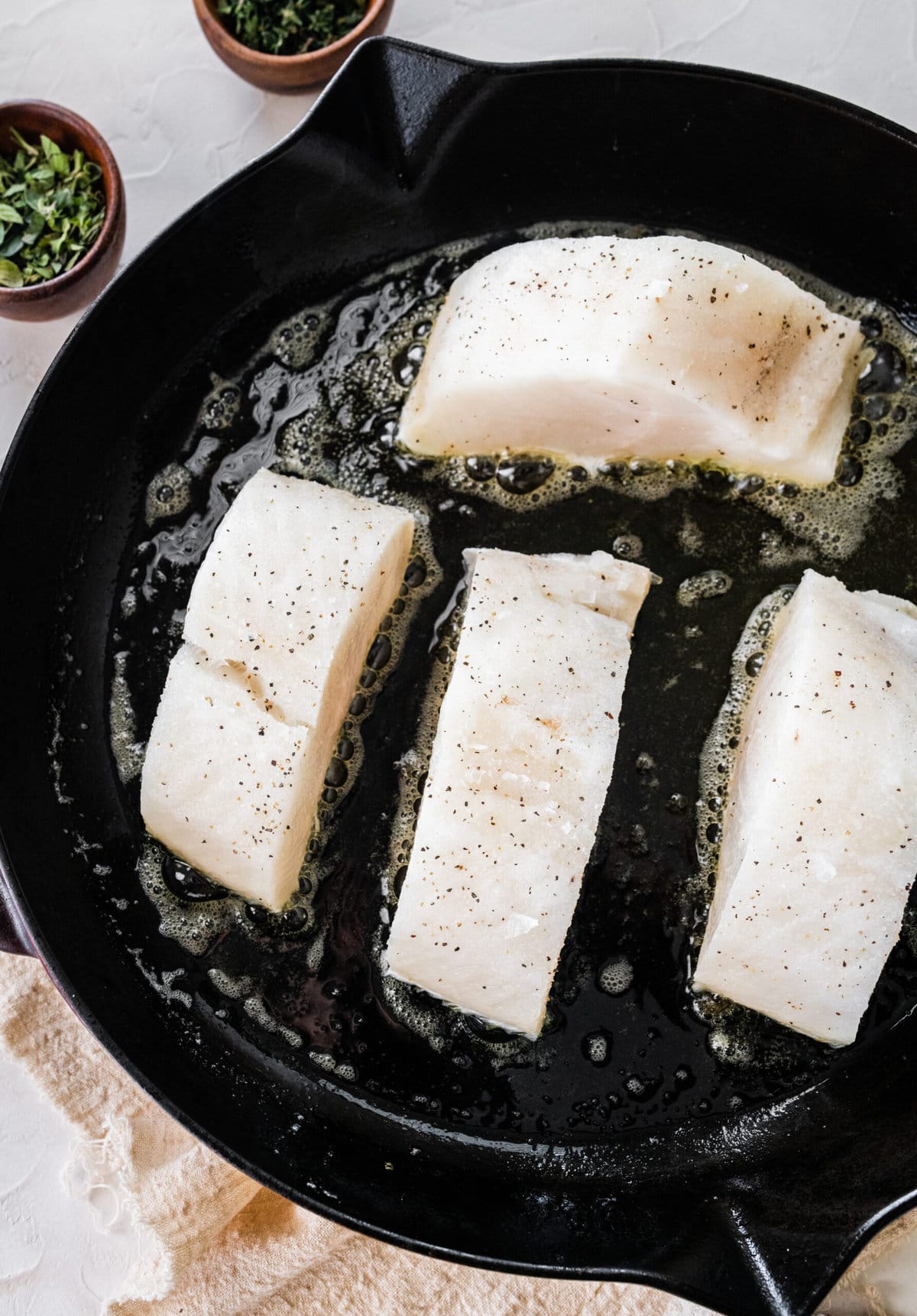 How to make pan seared chilean sea bass process: searing the sea bass in a pan
