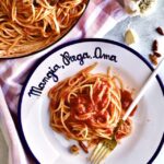 Best Arrabbiata Sauce Recipe (Spicy Spaghetti Sauce) serving dish and plate with spicy pasta sauce.
