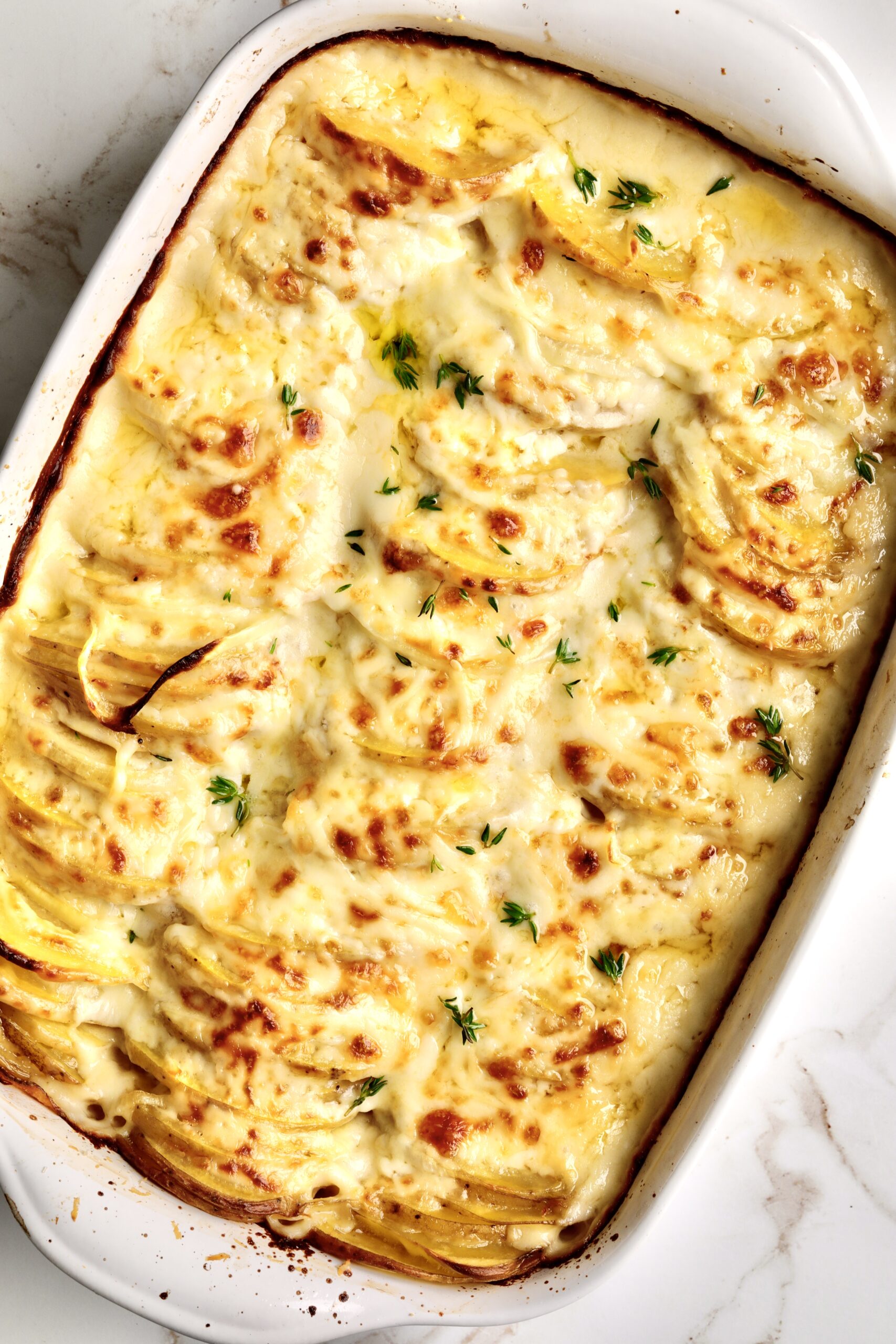 How to make Best Creamy Au Gratin Potatoes Recipe (Dad's Famous)-taking out of the over with golden brown crust. 