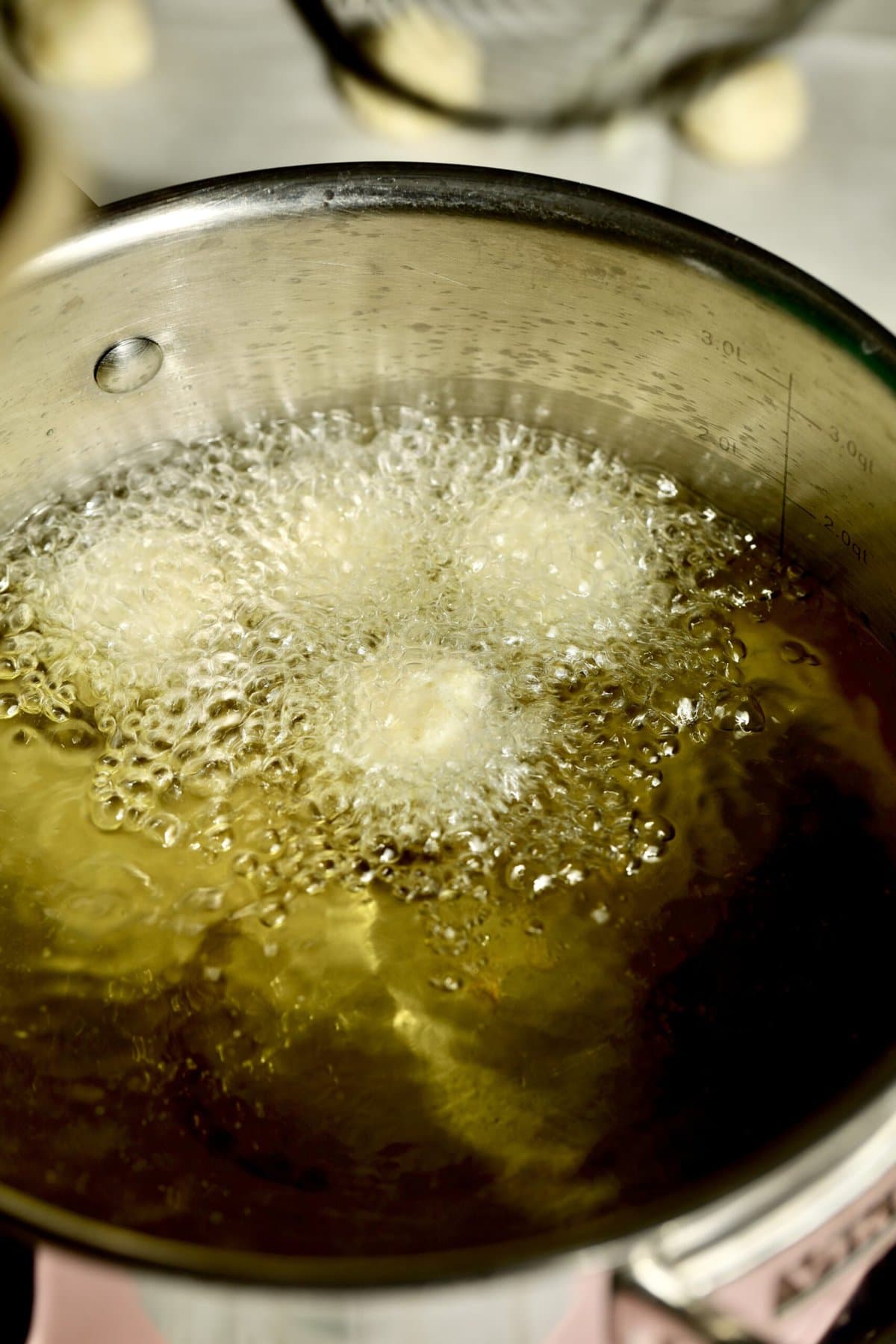 Process for making fried cheese balls- frying the cheese balls.