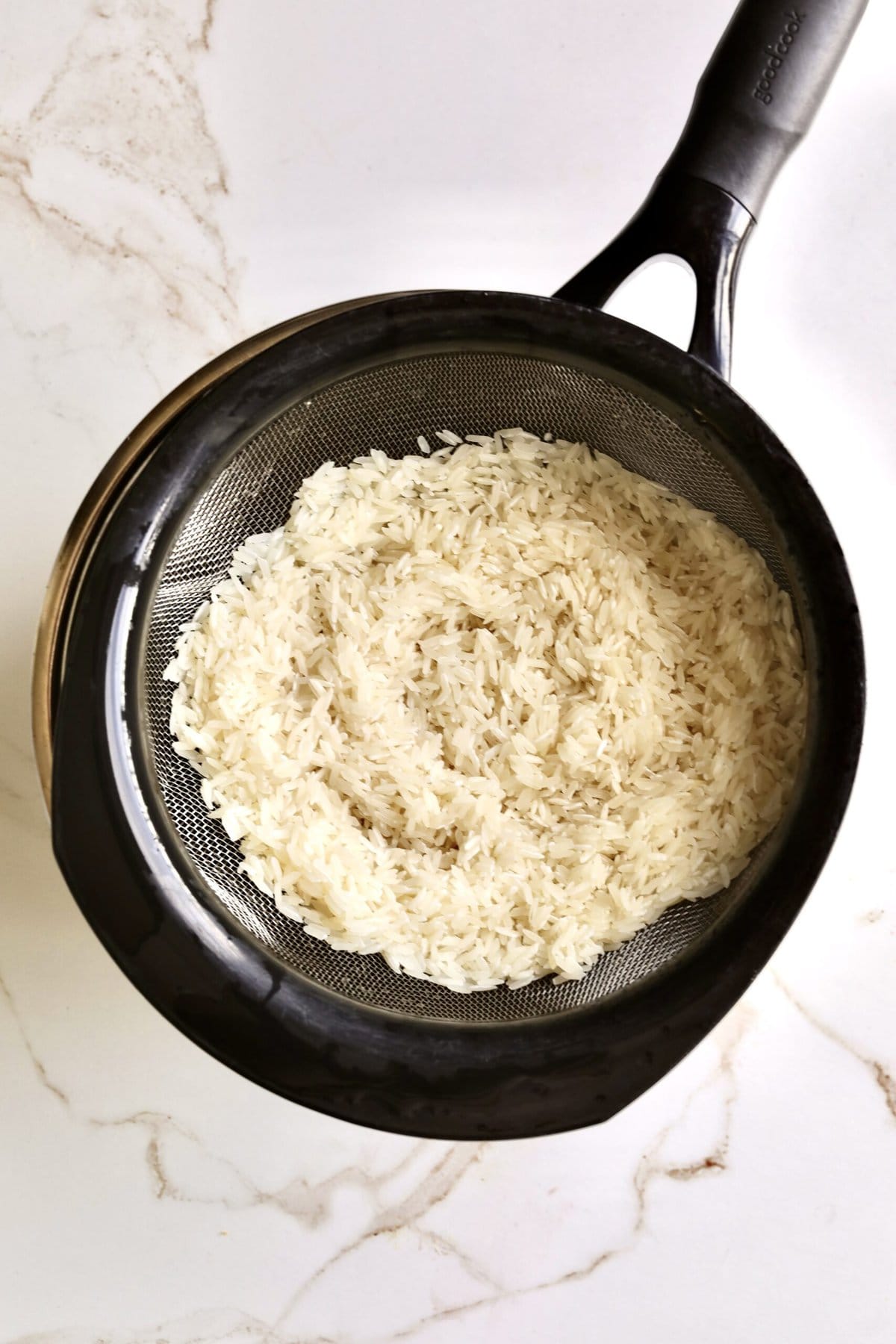 How to make Creamy Parmesan Rice Recipe (Quick and Easy Side): rinsing the rice .