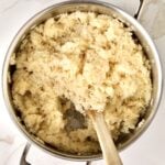 How to make Creamy Parmesan Rice Recipe (Quick and Easy Side): stirring in the butter and cheese to the cooked rice. Fluffing and mixing rice.