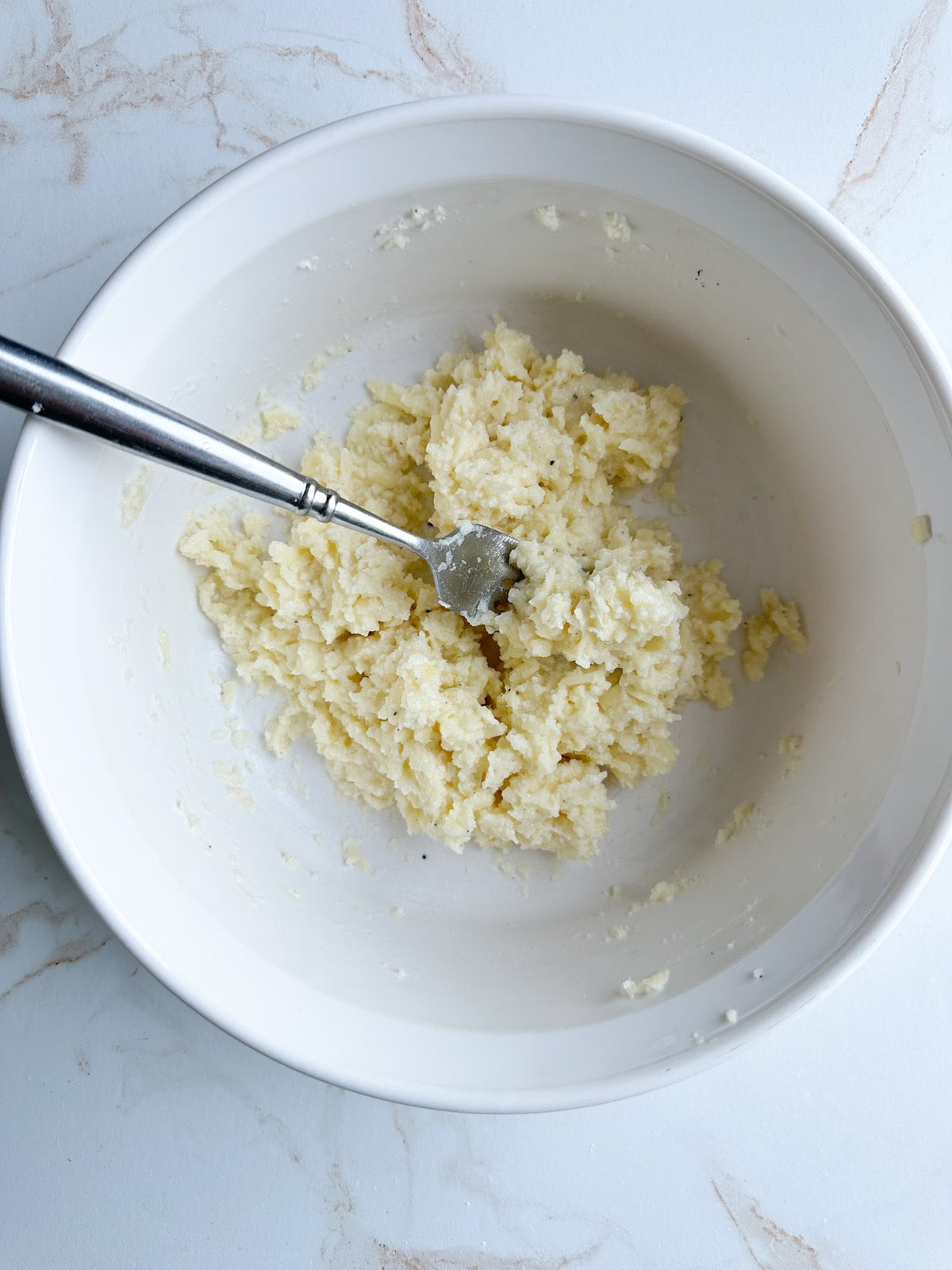 Process for making fried cheese balls- mixing cheese with egg whites.