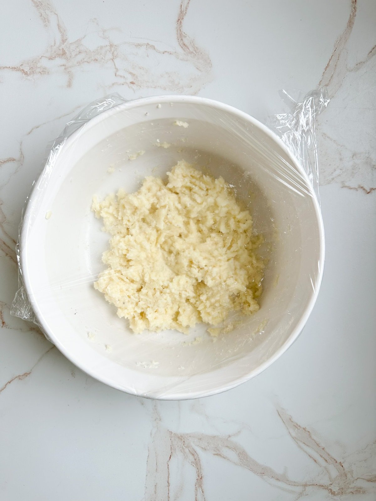 Process for making fried cheese balls- covering cheese mixture and letting it rest in the fridge.