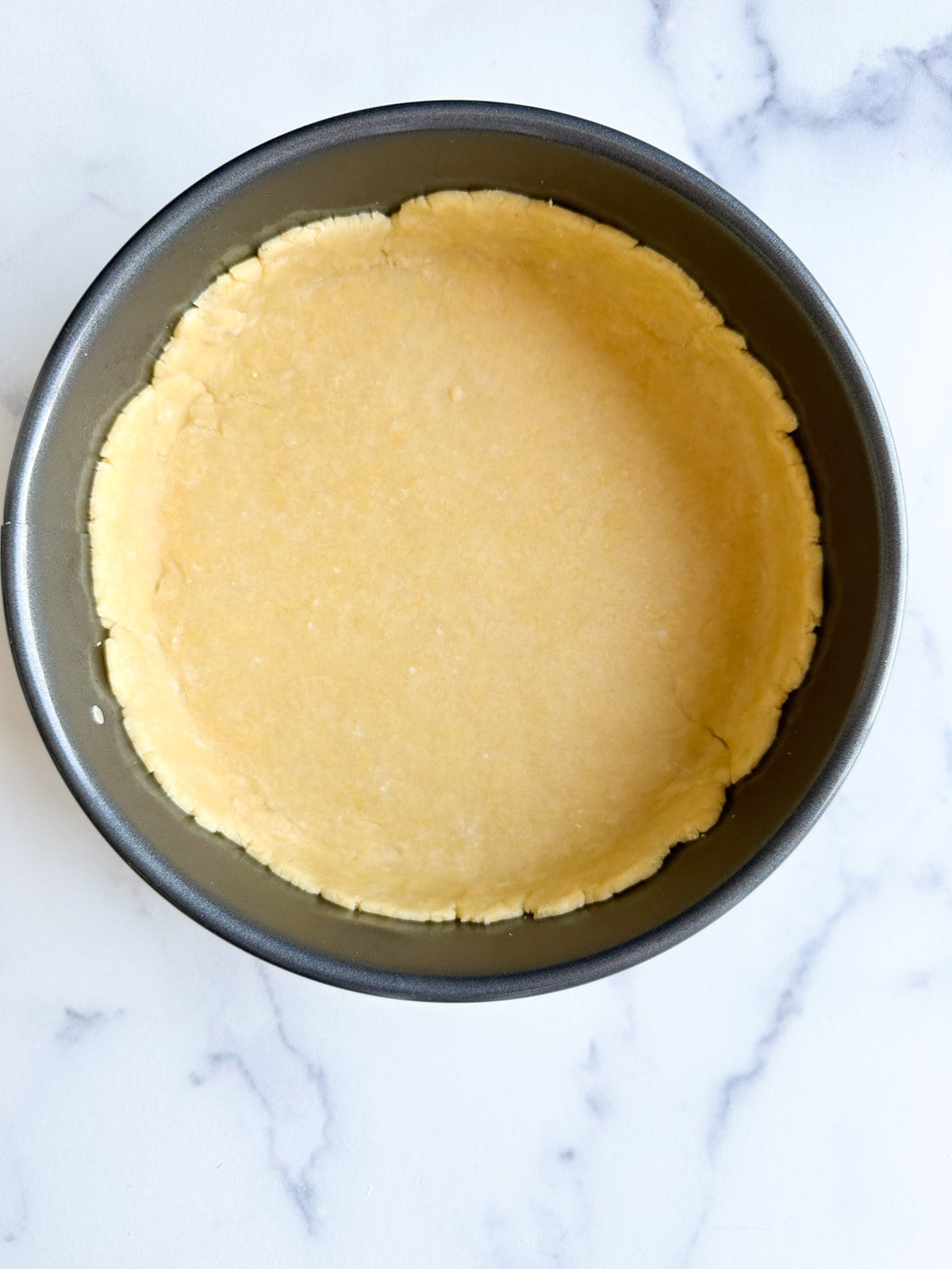 prepared pasta frolla dough in 9' in springform pan.