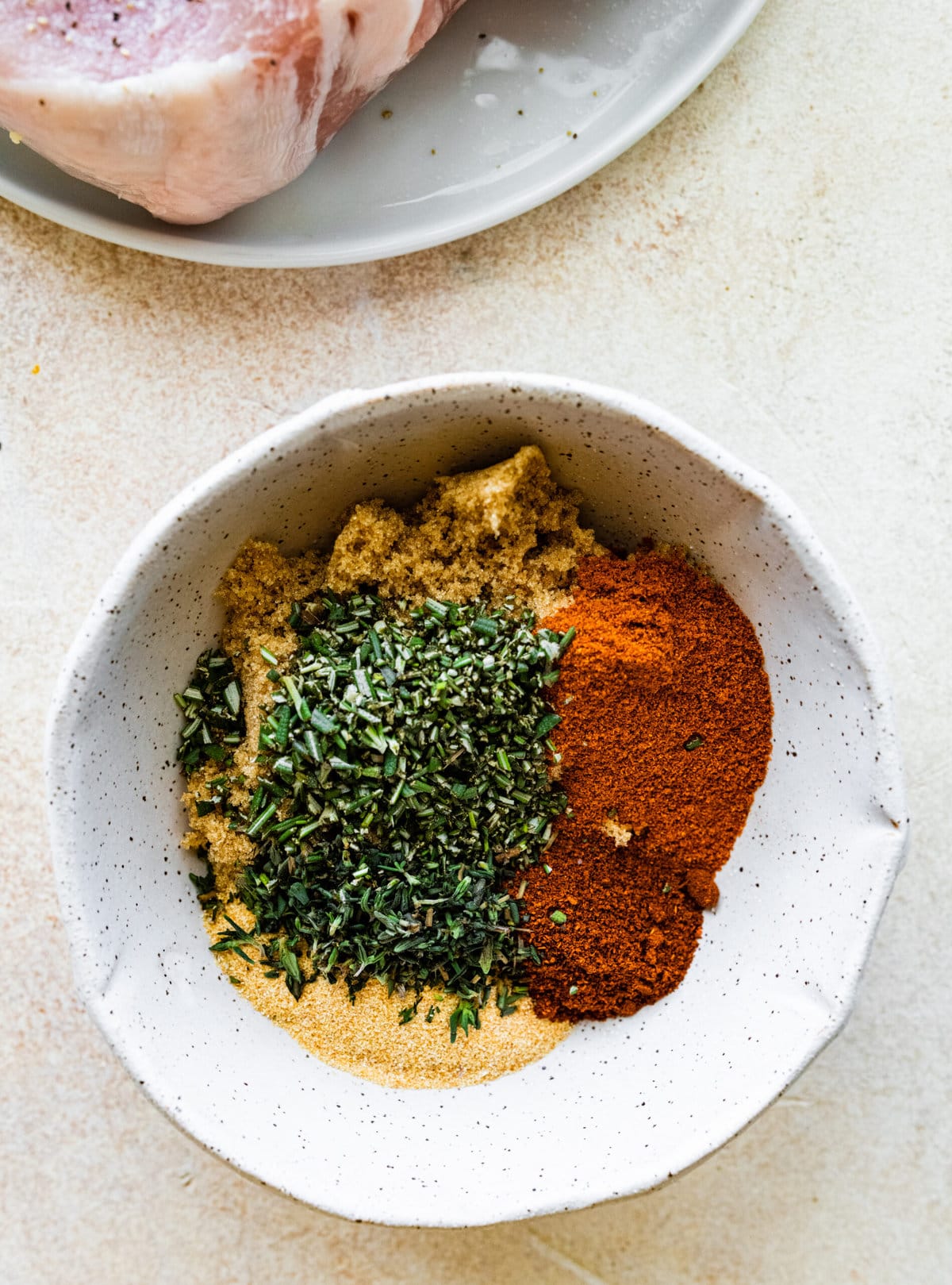 Step-by-step photos for How to cook thick pork chops- combine the seasoning ingredients in a bowl.