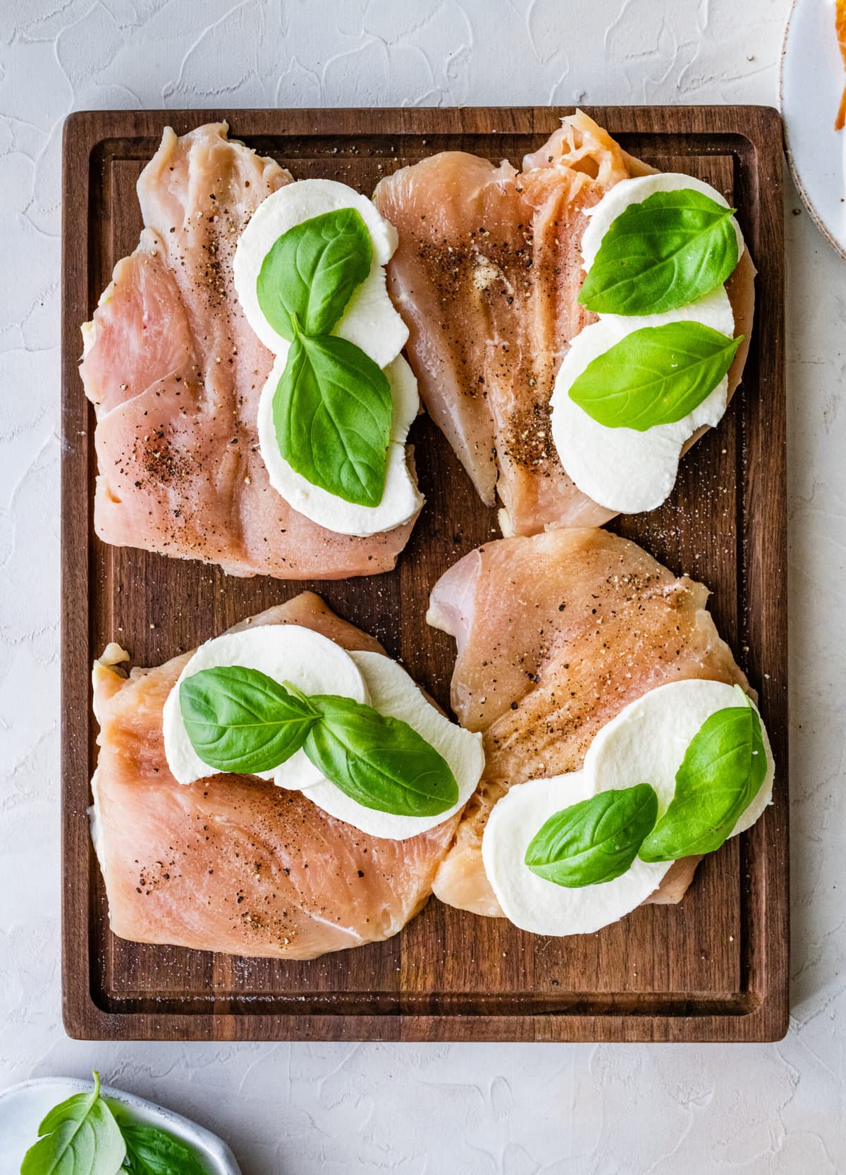 How to make Mozzarella stuffed Chicken chicken- cut chicken stuffed with mozzarella slices and basil.