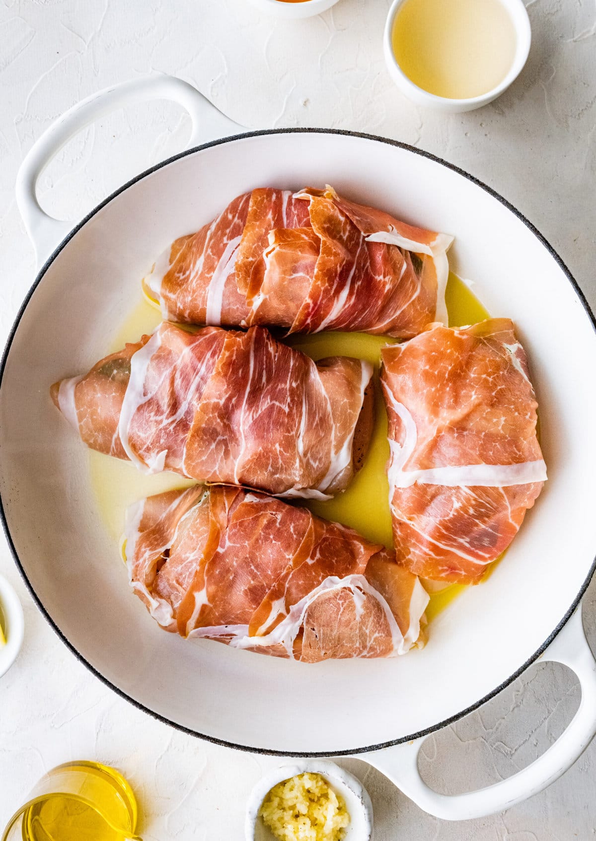 How to make Mozzarella stuffed Chicken chicken- stuffed chicken wrapped in parma ham placed in pan and browned on both sides.