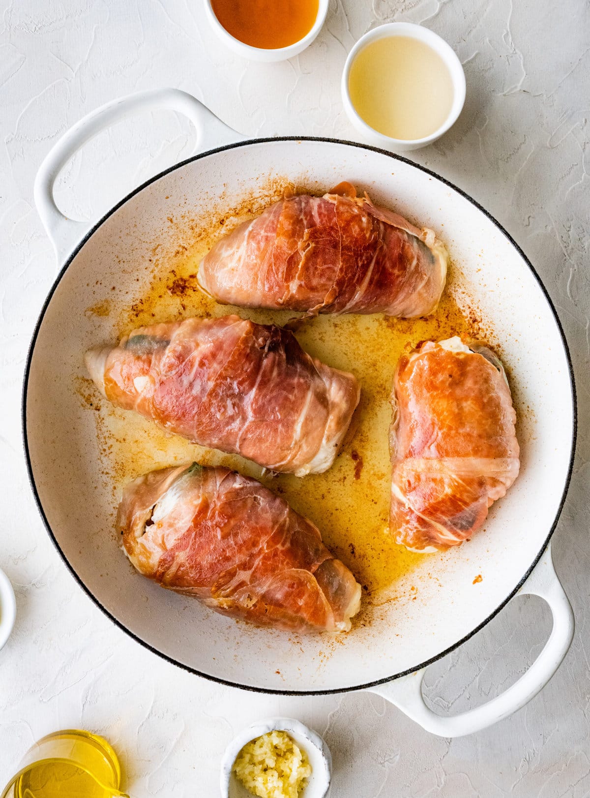 How to make Mozzarella stuffed Chicken chicken- stuffed chicken wrapped in parma ham placed in pan and browned on both sides.