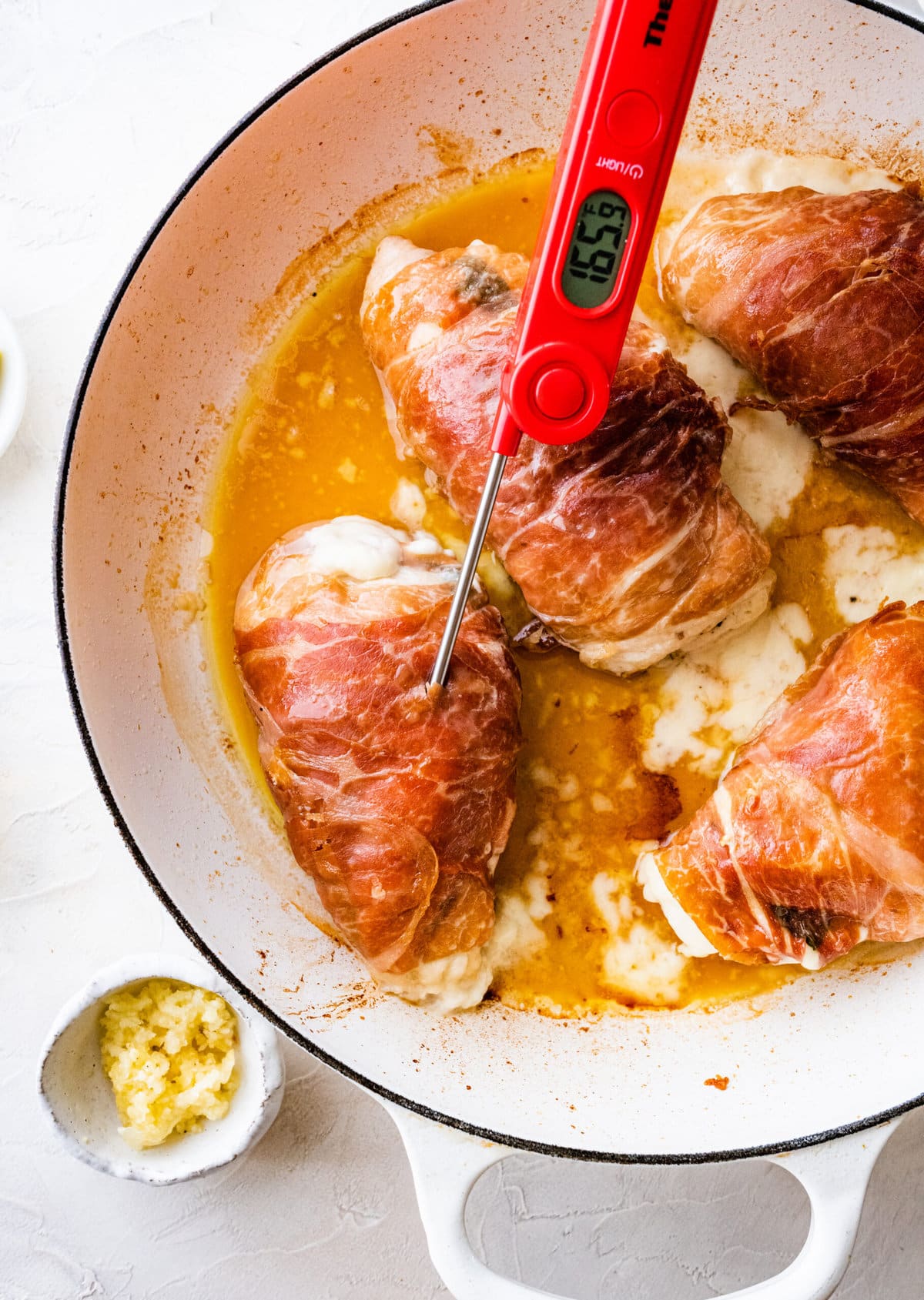 How to make Mozzarella stuffed Chicken chicken- stuffed chicken wrapped in parma ham placed in pan and browned on both sides. Baked in oven and cook until 165 degree F internal temp.