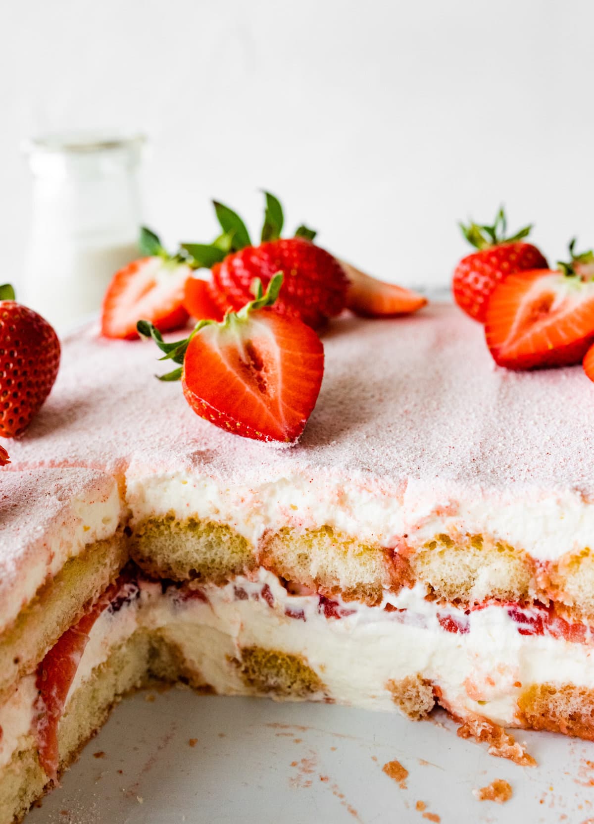 Easy Strawberry tiramisu sliced and cut out the middle to see the layers. Cut strawberries on top.